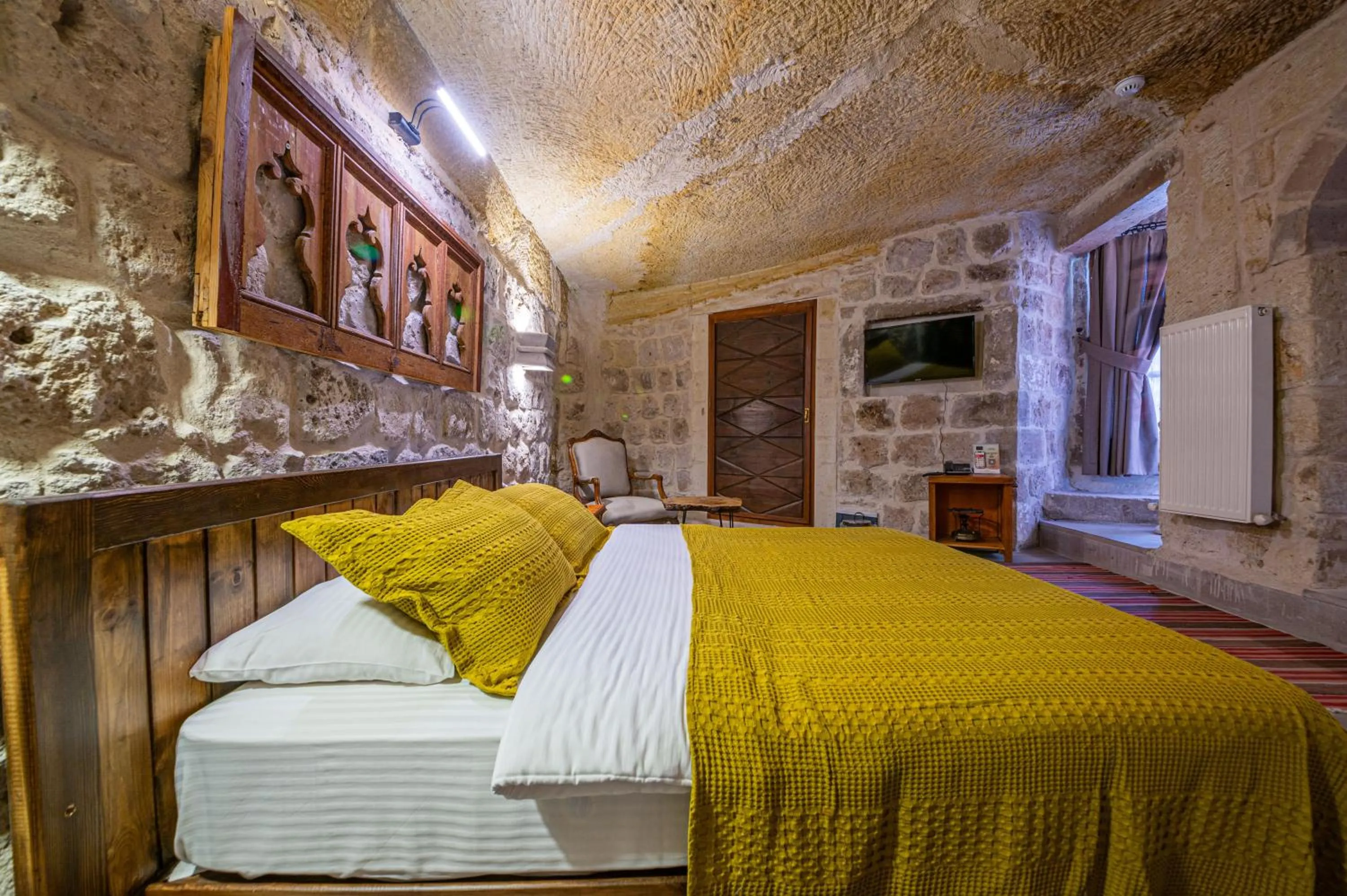 Bed in Kapalos Cave Hotel
