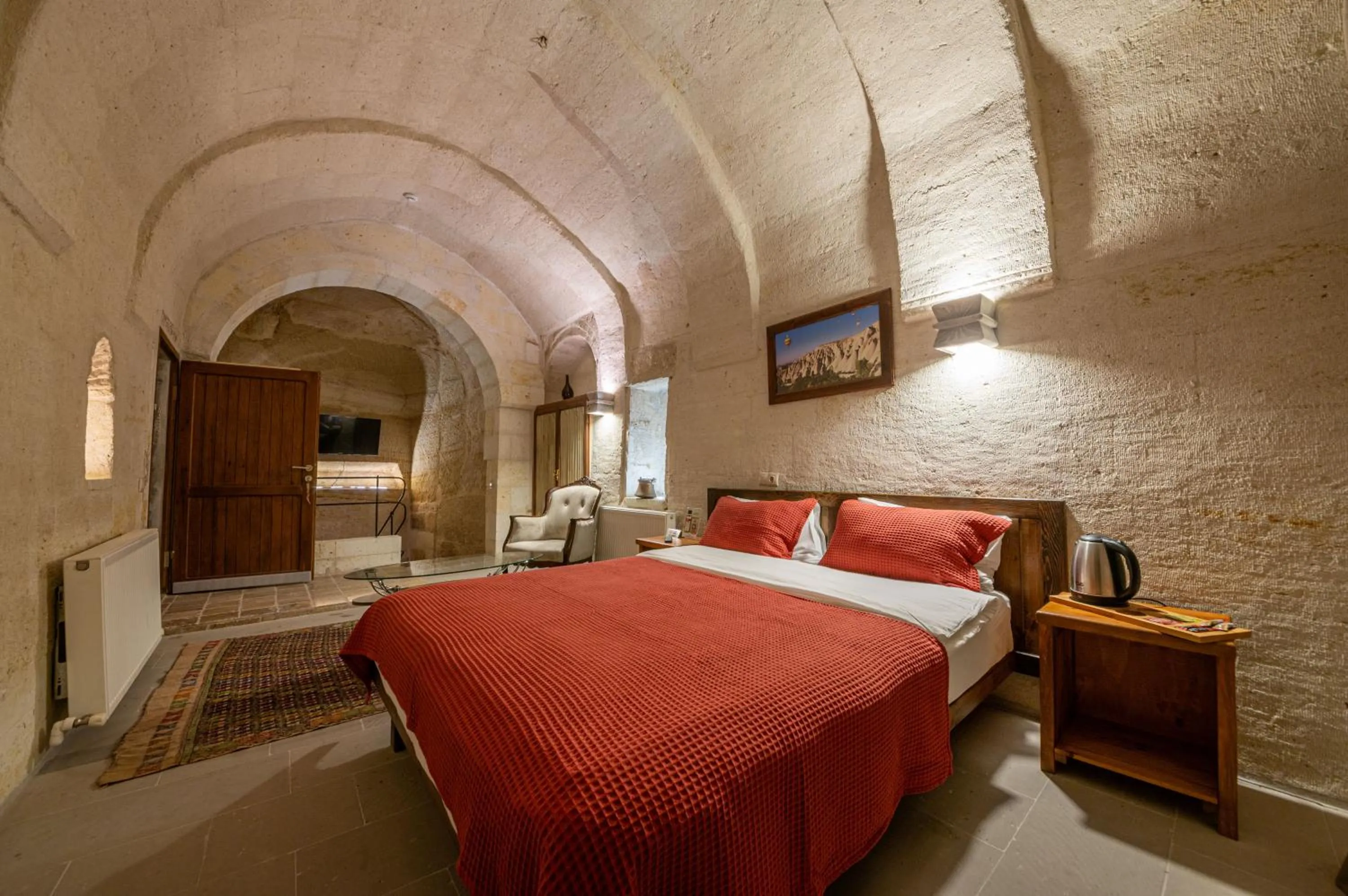 Bed in Kapalos Cave Hotel
