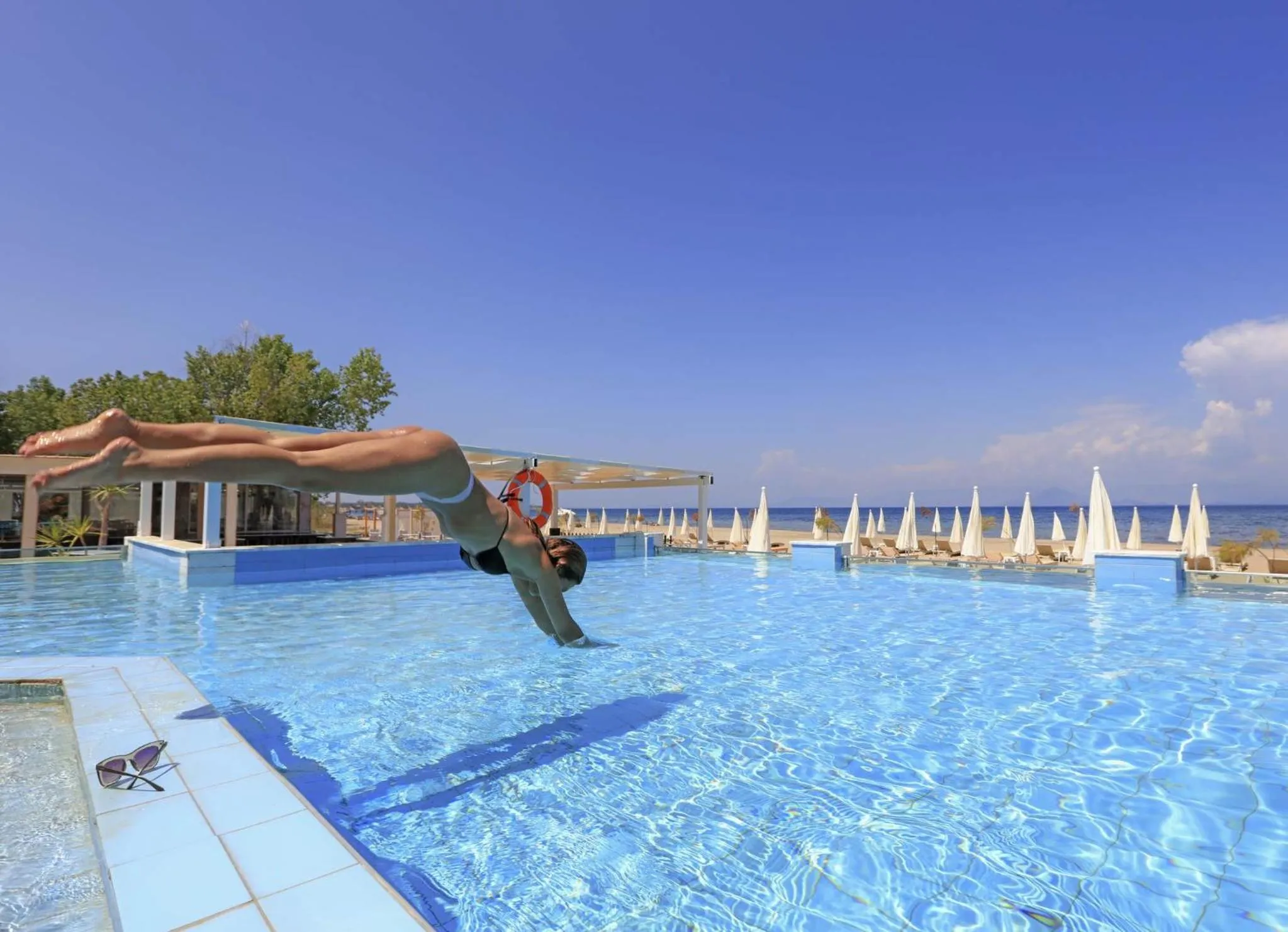 People in Cavomarina Beach- Adults Only