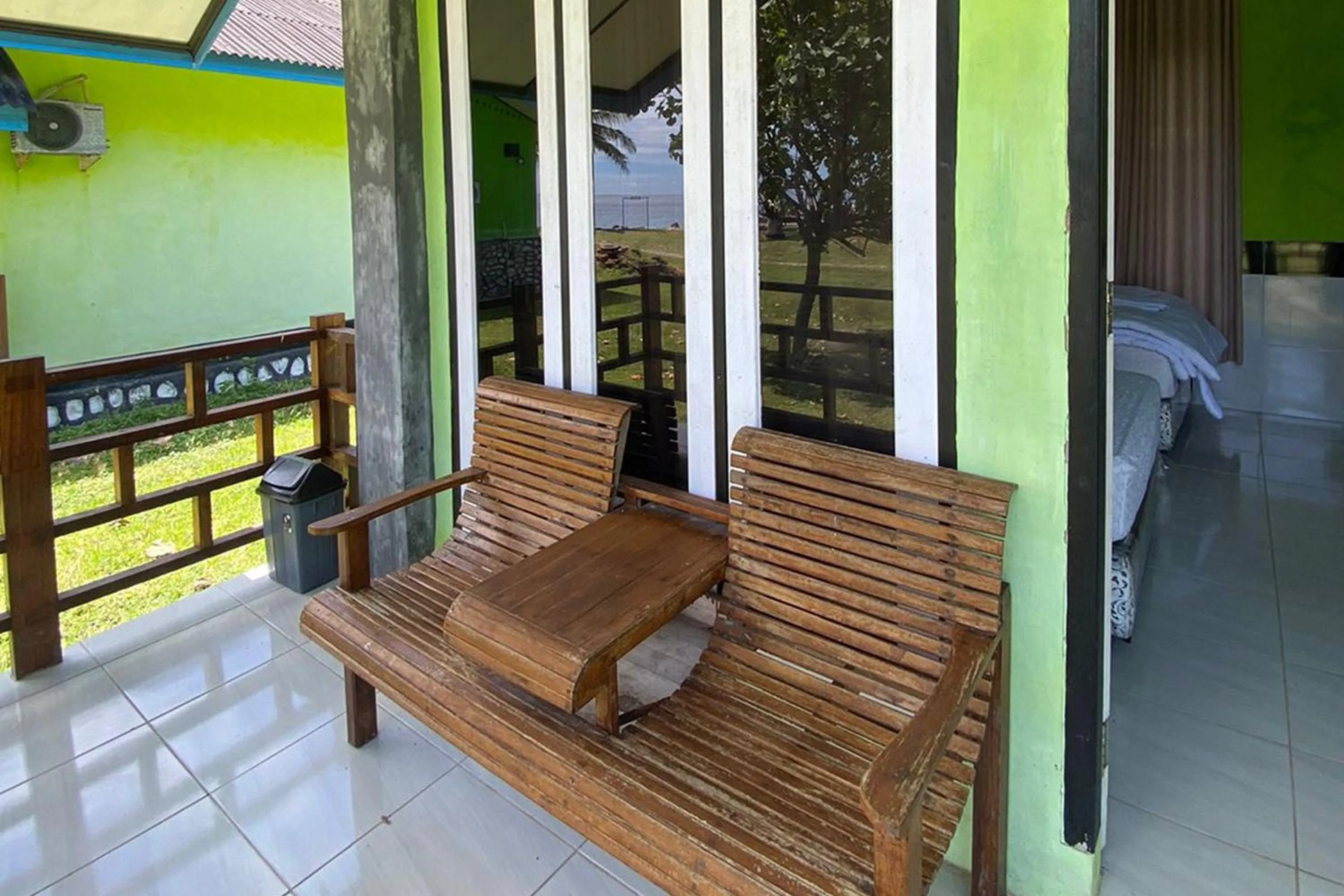 Seating area in RedDoorz Syariah near Ujong Kareung Beach Sabang