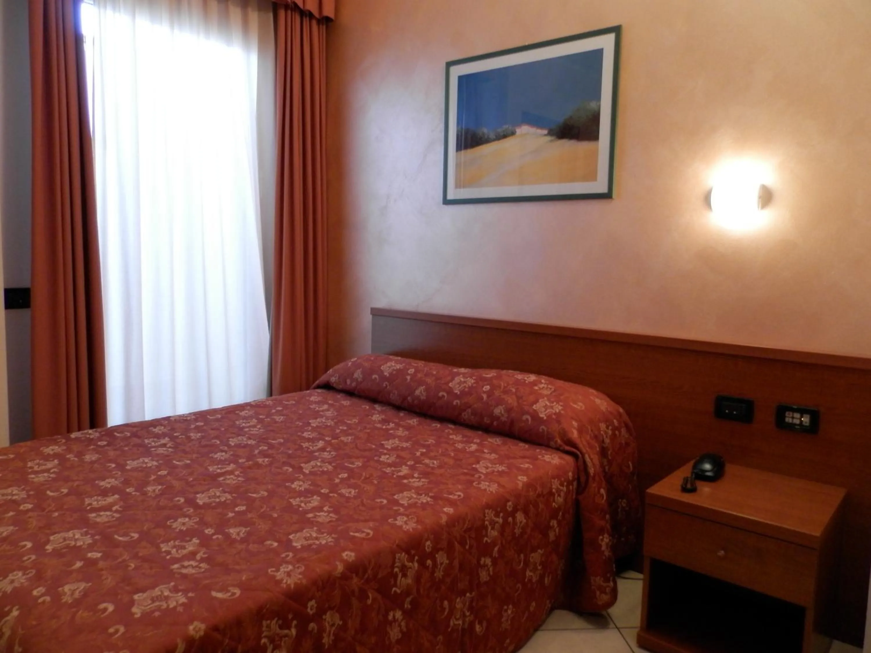 Bed in Hotel Stazione