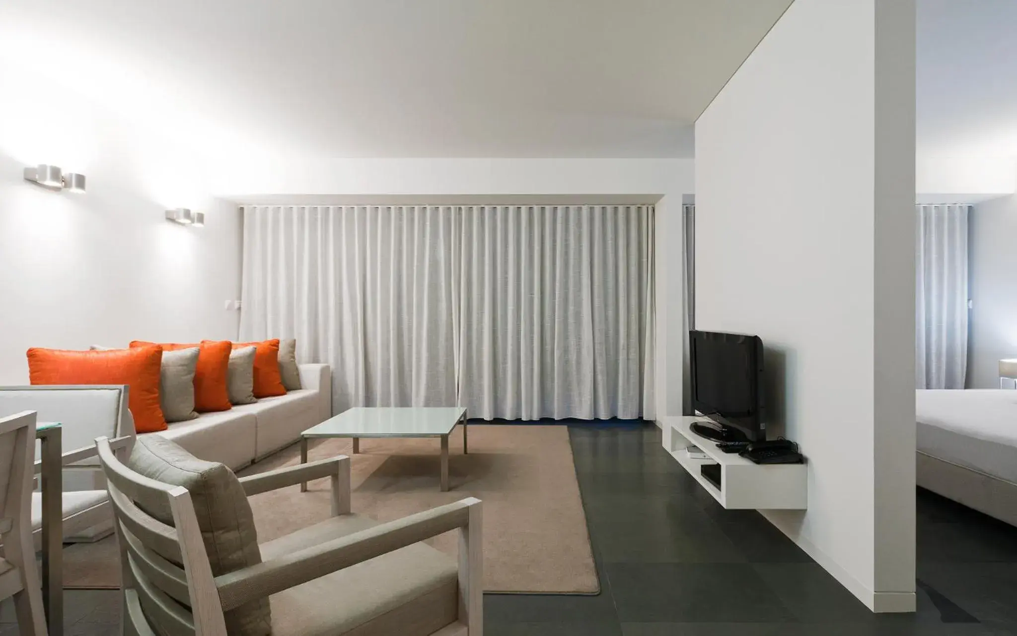 Living room, Bed in Troia Residence by The Editory - Apartamentos Ácala Living room, Bed in Troia Residence by The Editory - Apartamentos Ácala