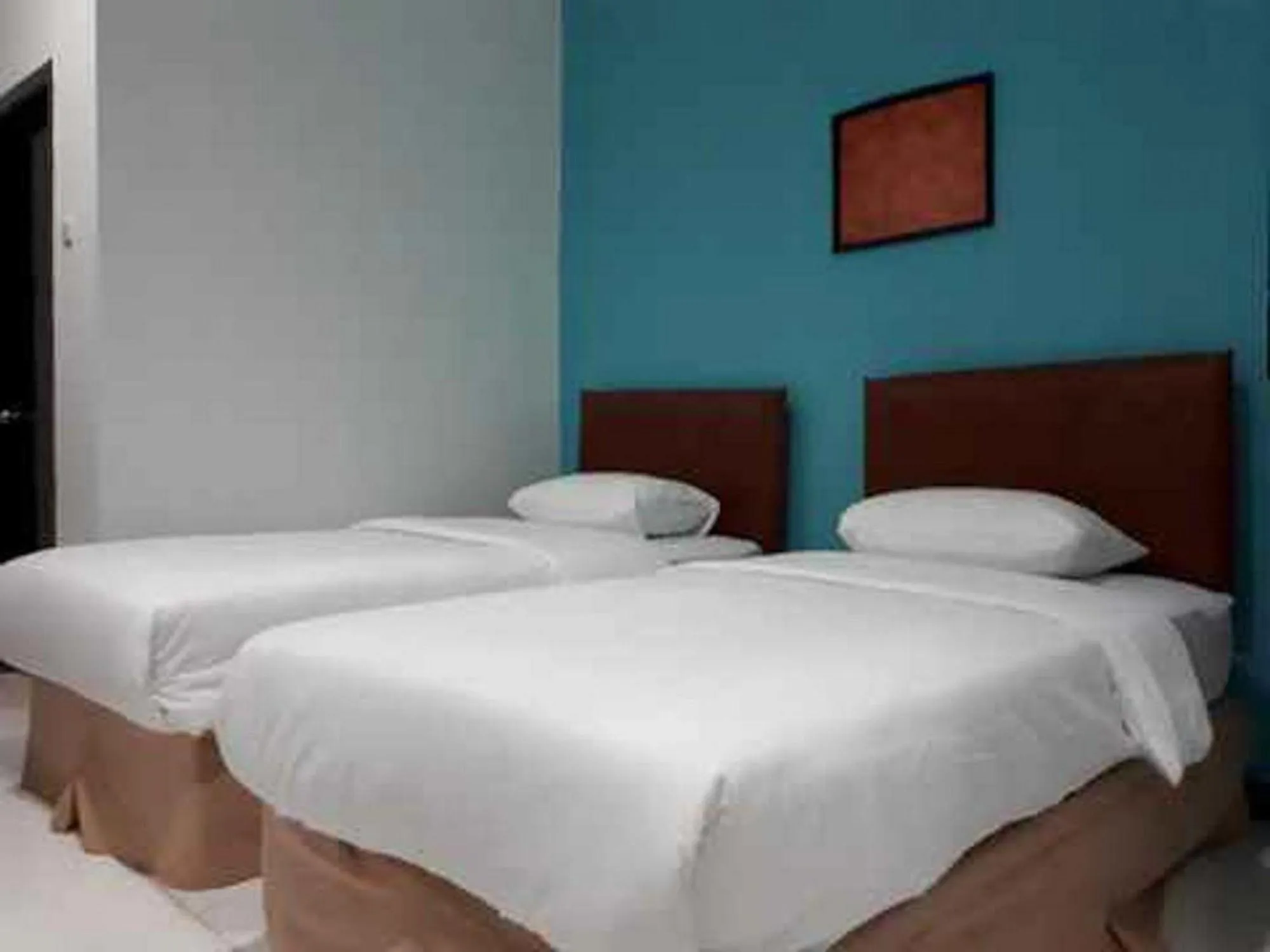 Bed in RedDoorz at Hotel Rumberpon Sorong