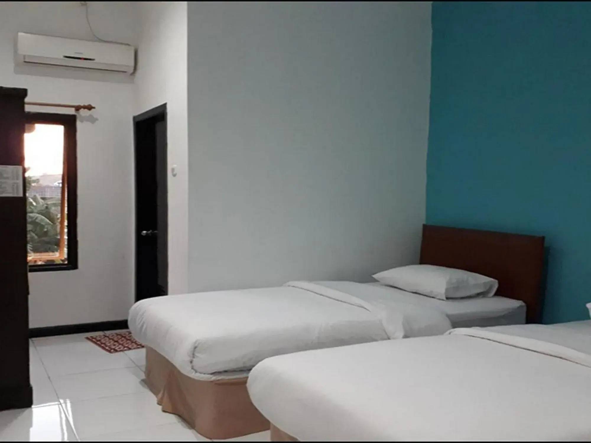 Bed in RedDoorz at Hotel Rumberpon Sorong Bed in RedDoorz at Hotel Rumberpon Sorong