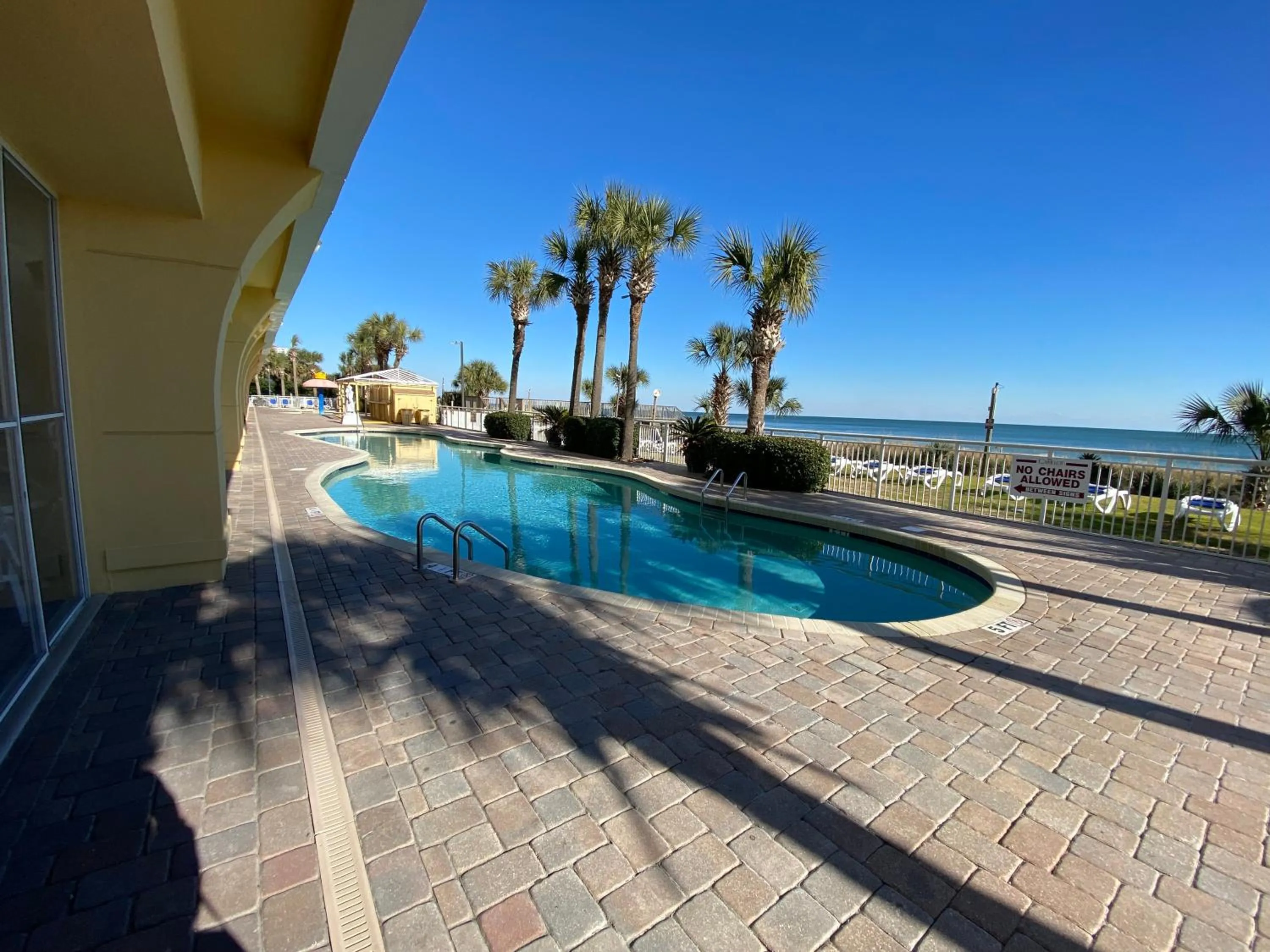 Swimming pool in Camelot By The Sea Ocean Front Condo