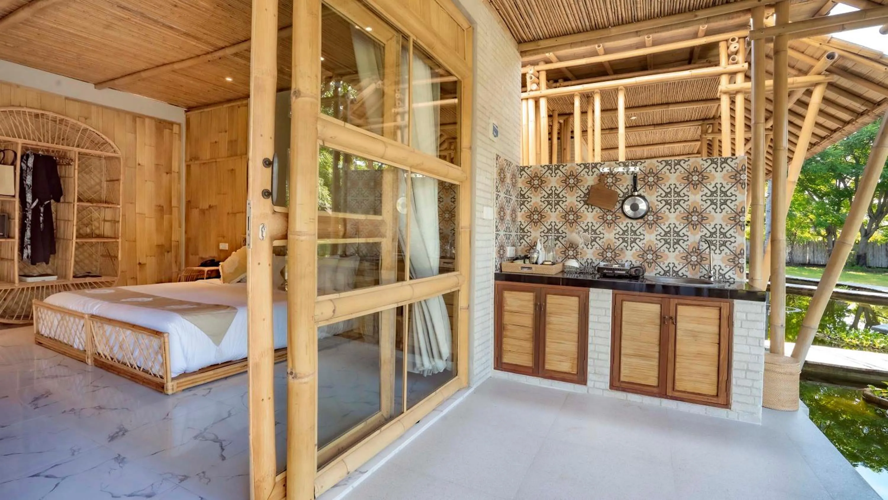 kitchen, Bed in Pravasa Gili Resort by KajaNe