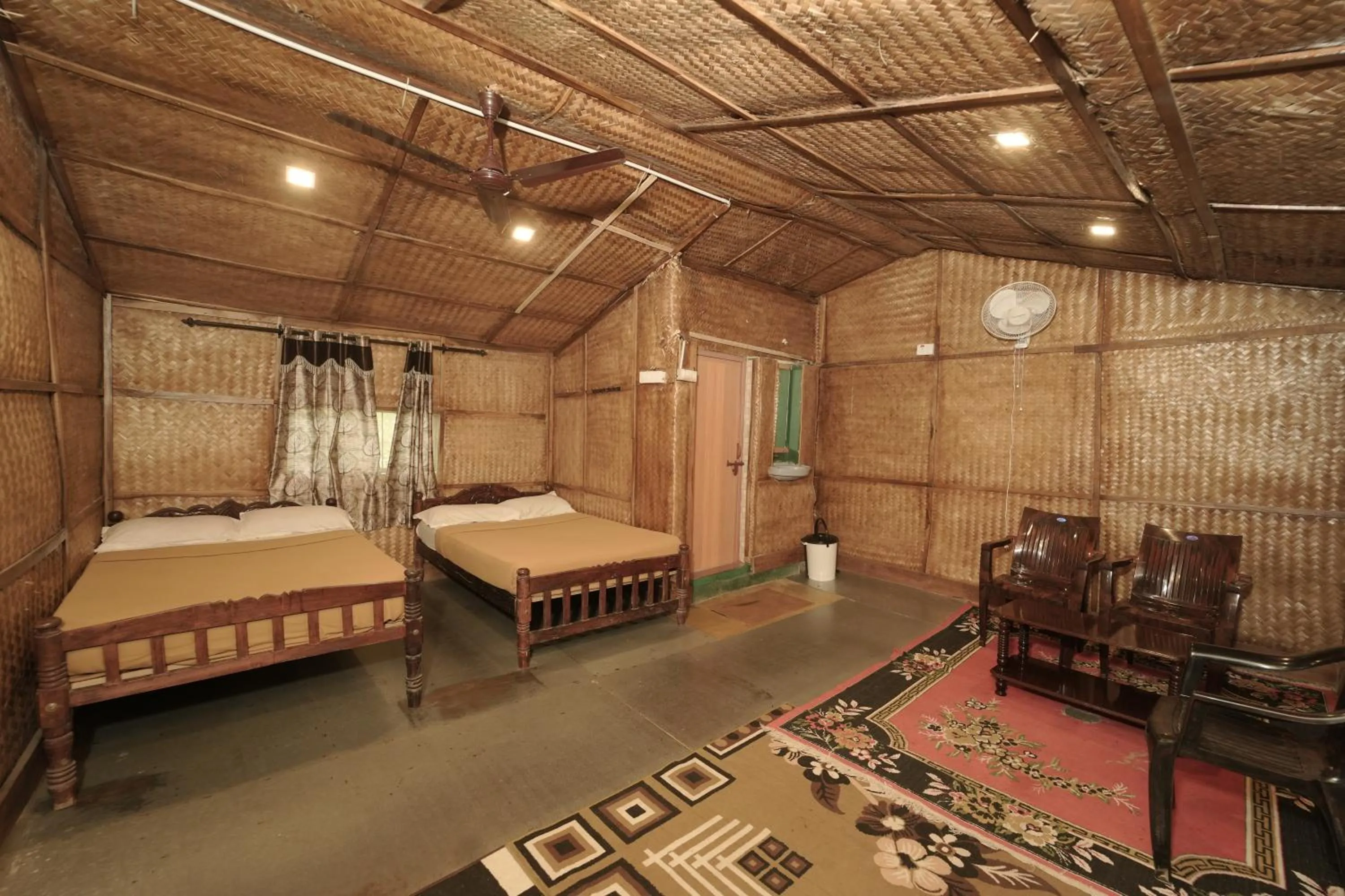 Bed in JUNGLE PARADISE FARM & GUEST HOUSE