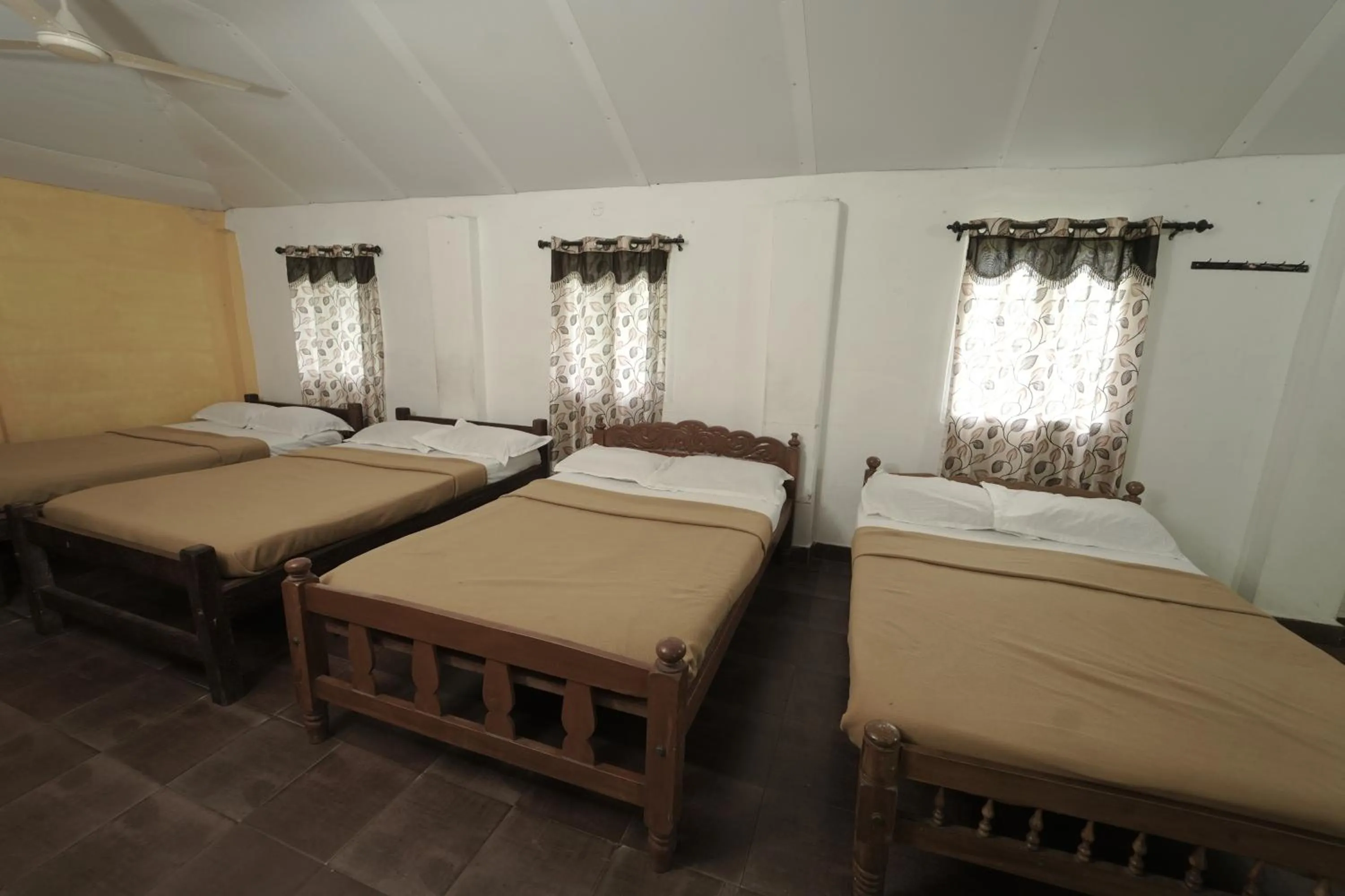 Bed in JUNGLE PARADISE FARM & GUEST HOUSE