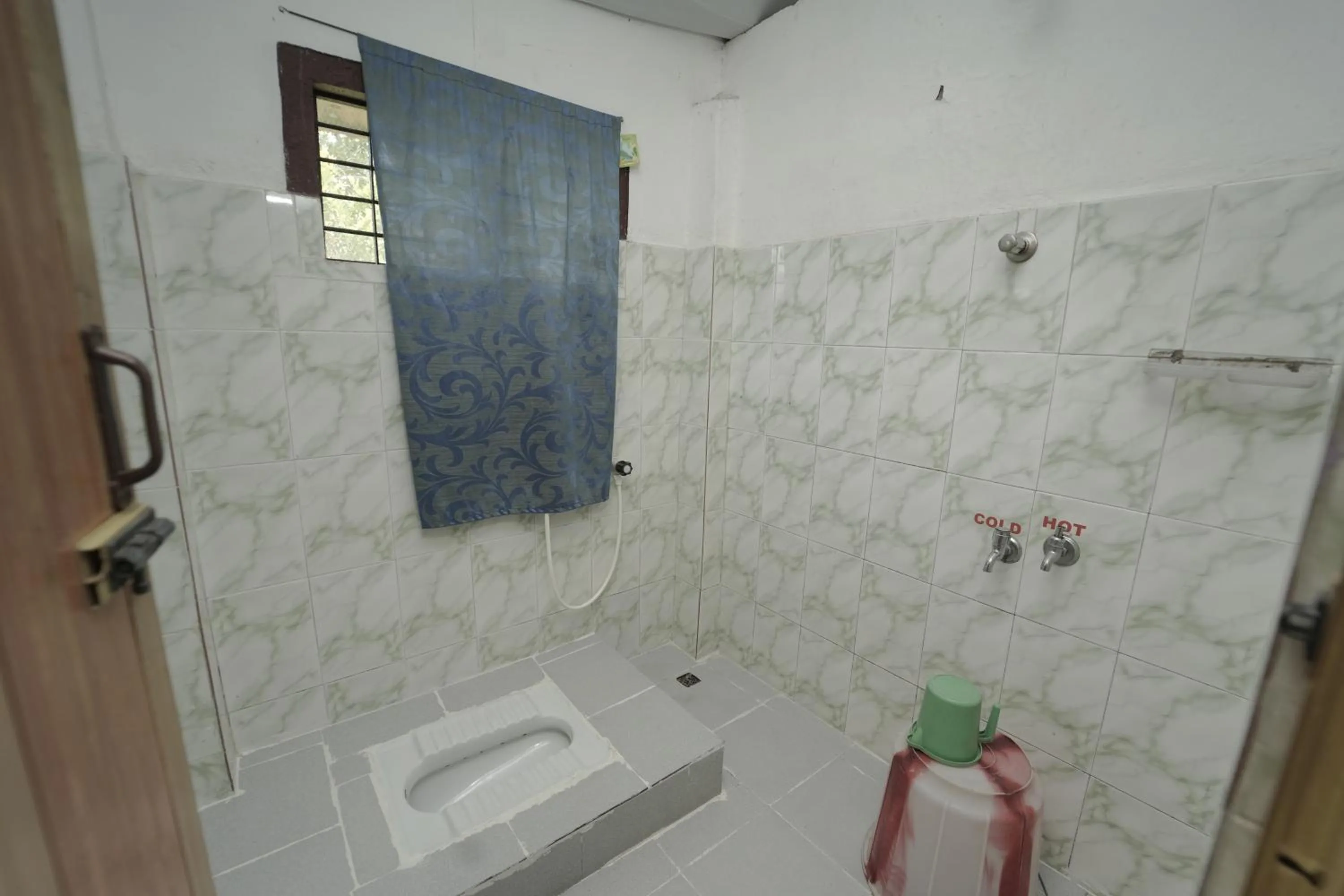 Toilet in JUNGLE PARADISE FARM & GUEST HOUSE