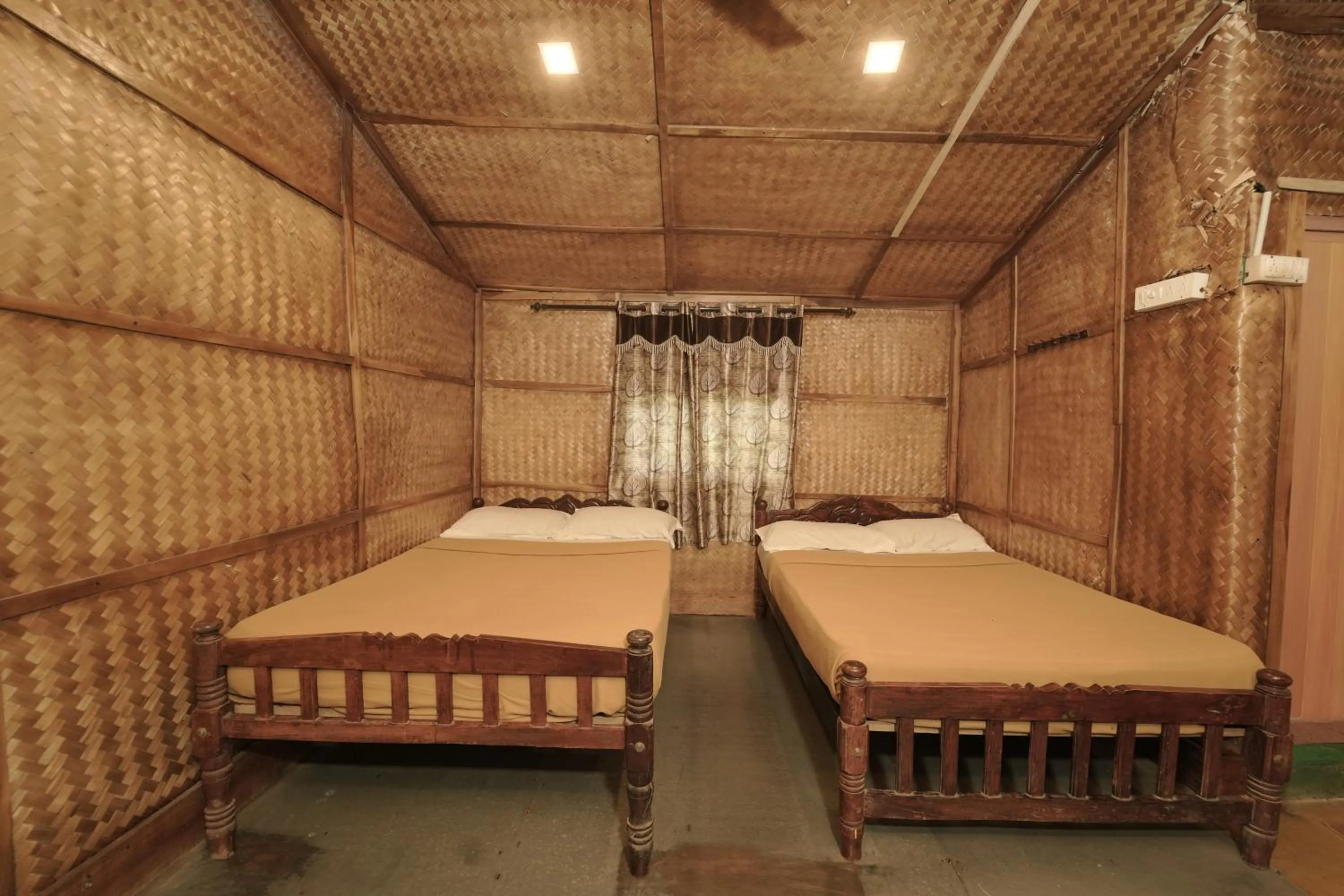 Bed in JUNGLE PARADISE FARM & GUEST HOUSE