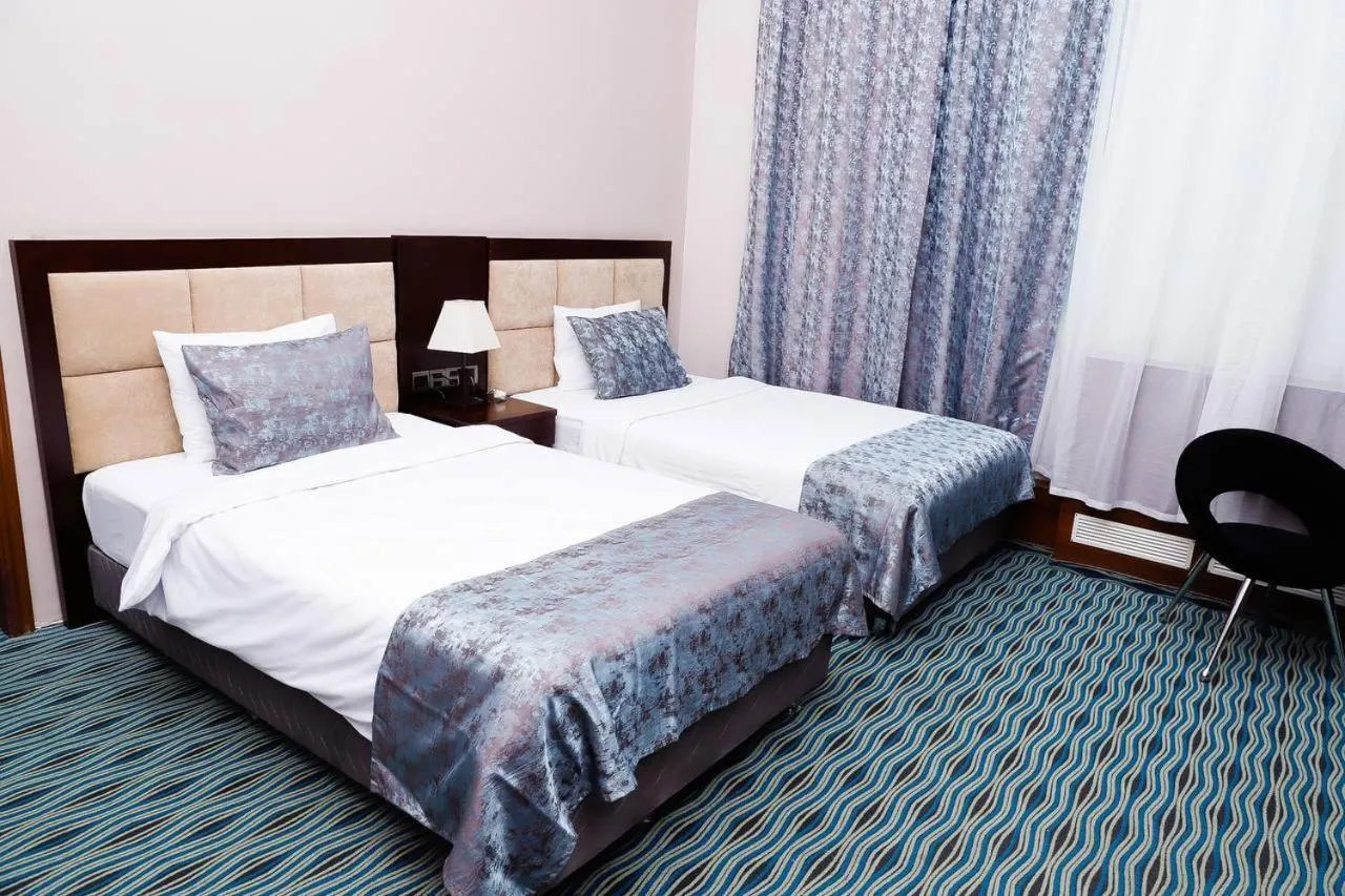 Bed in Ruma Port Hotel