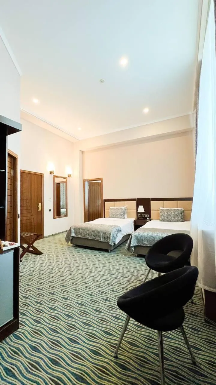 Bed in Ruma Port Hotel