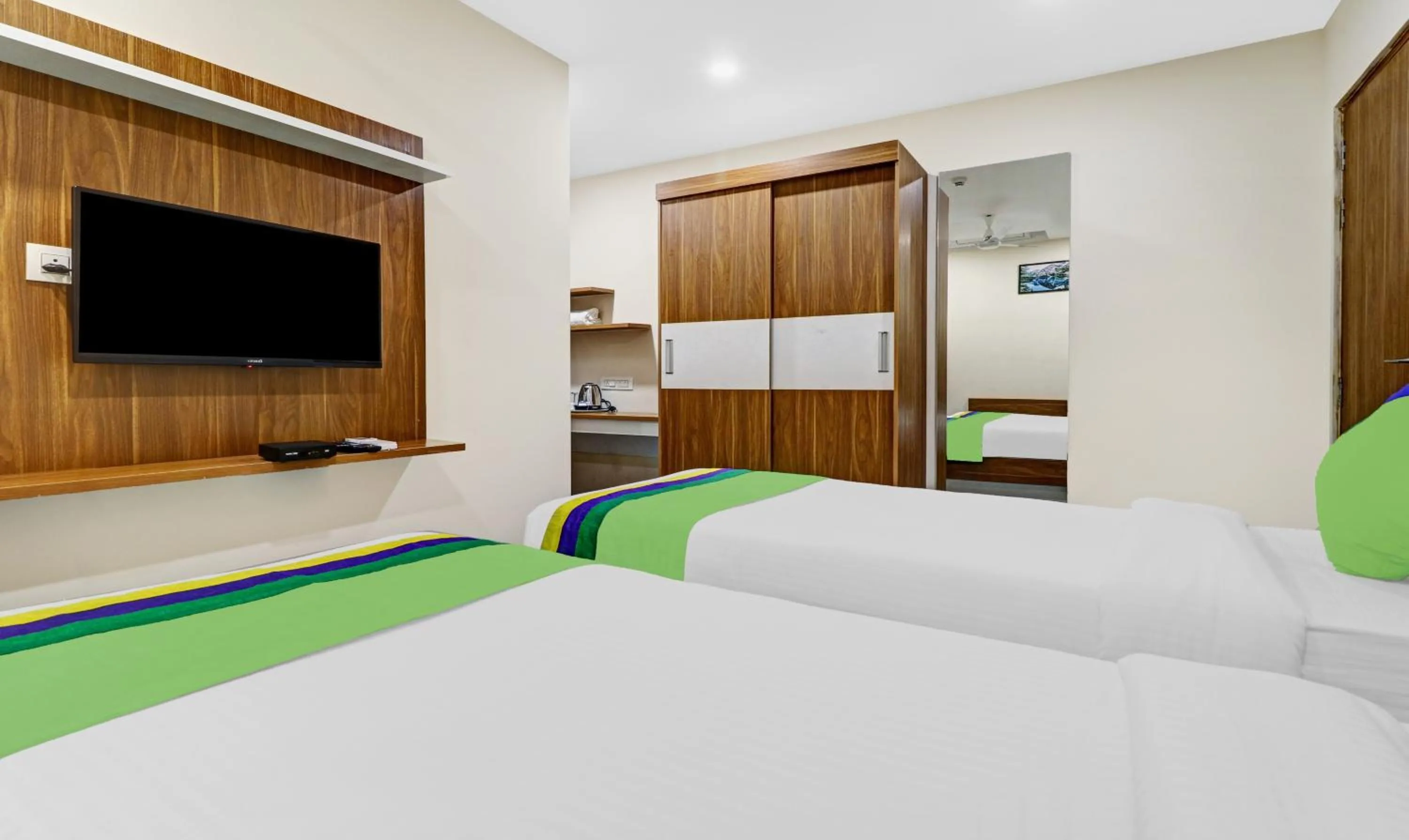 Bedroom, Bed in Treebo Purple Orchid Boutique