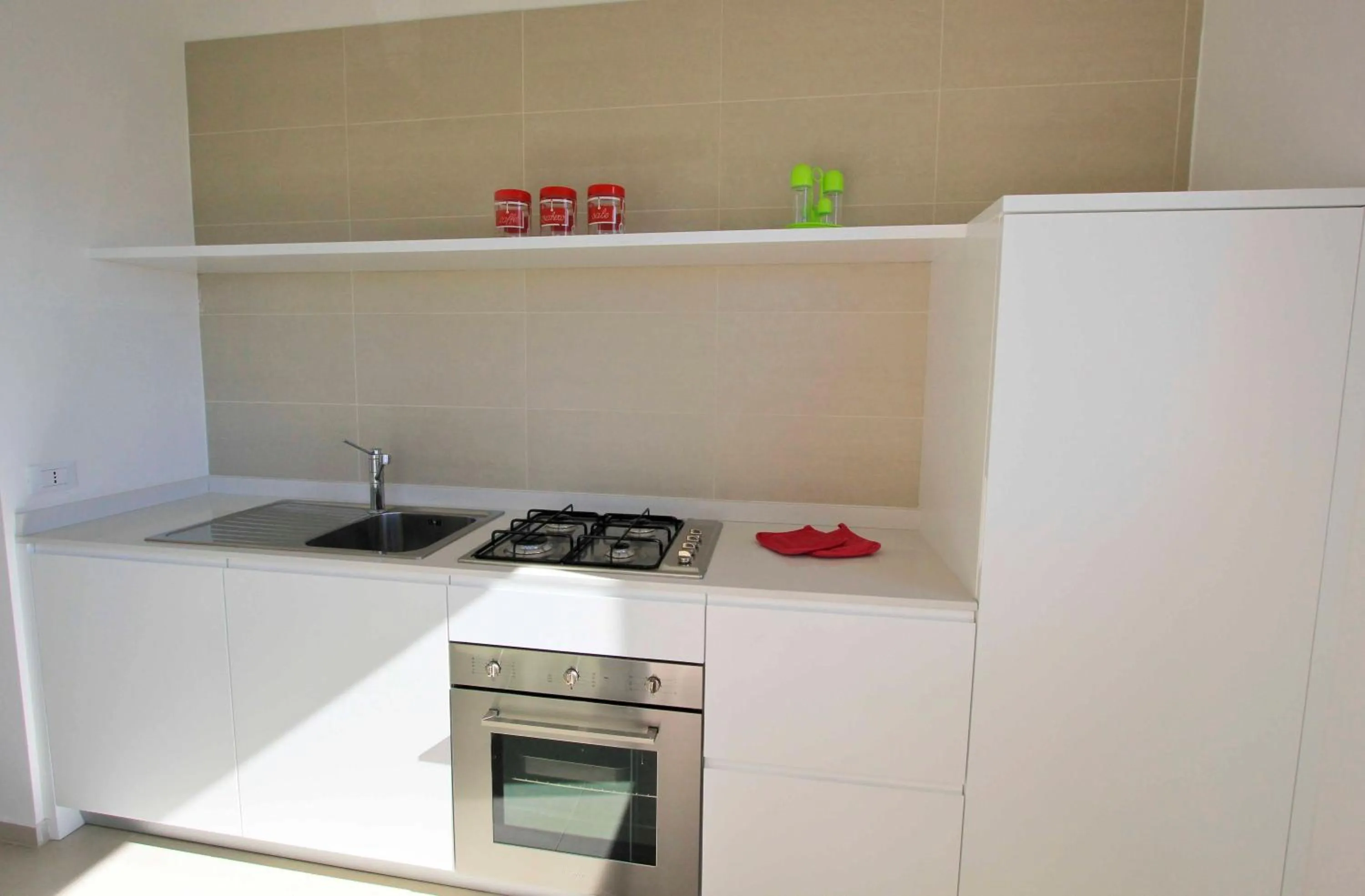 Kitchen or kitchenette in Appartamenti Sud Est