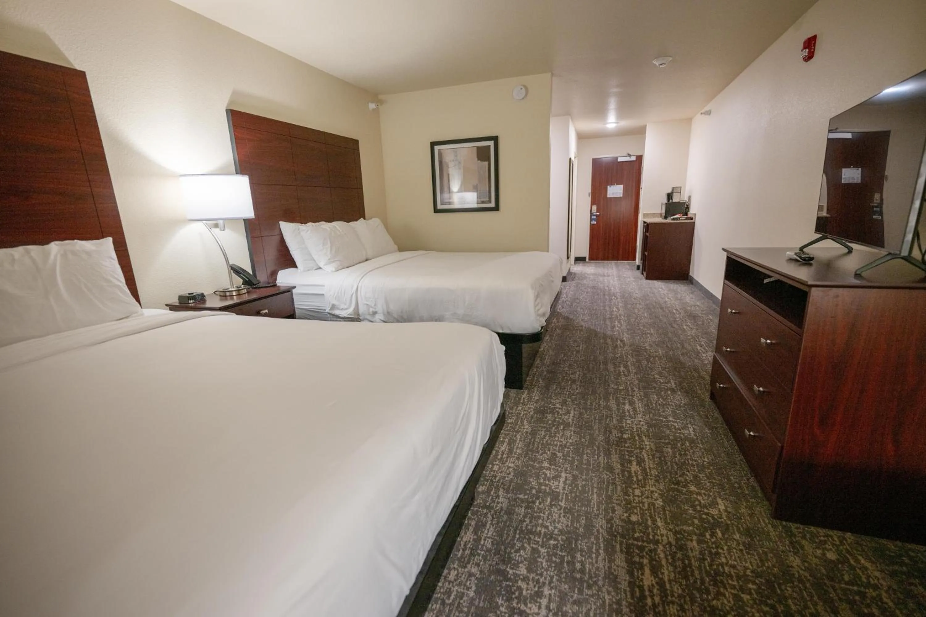 Bedroom, Bed in Cobblestone Hotel & Suites - Lamar