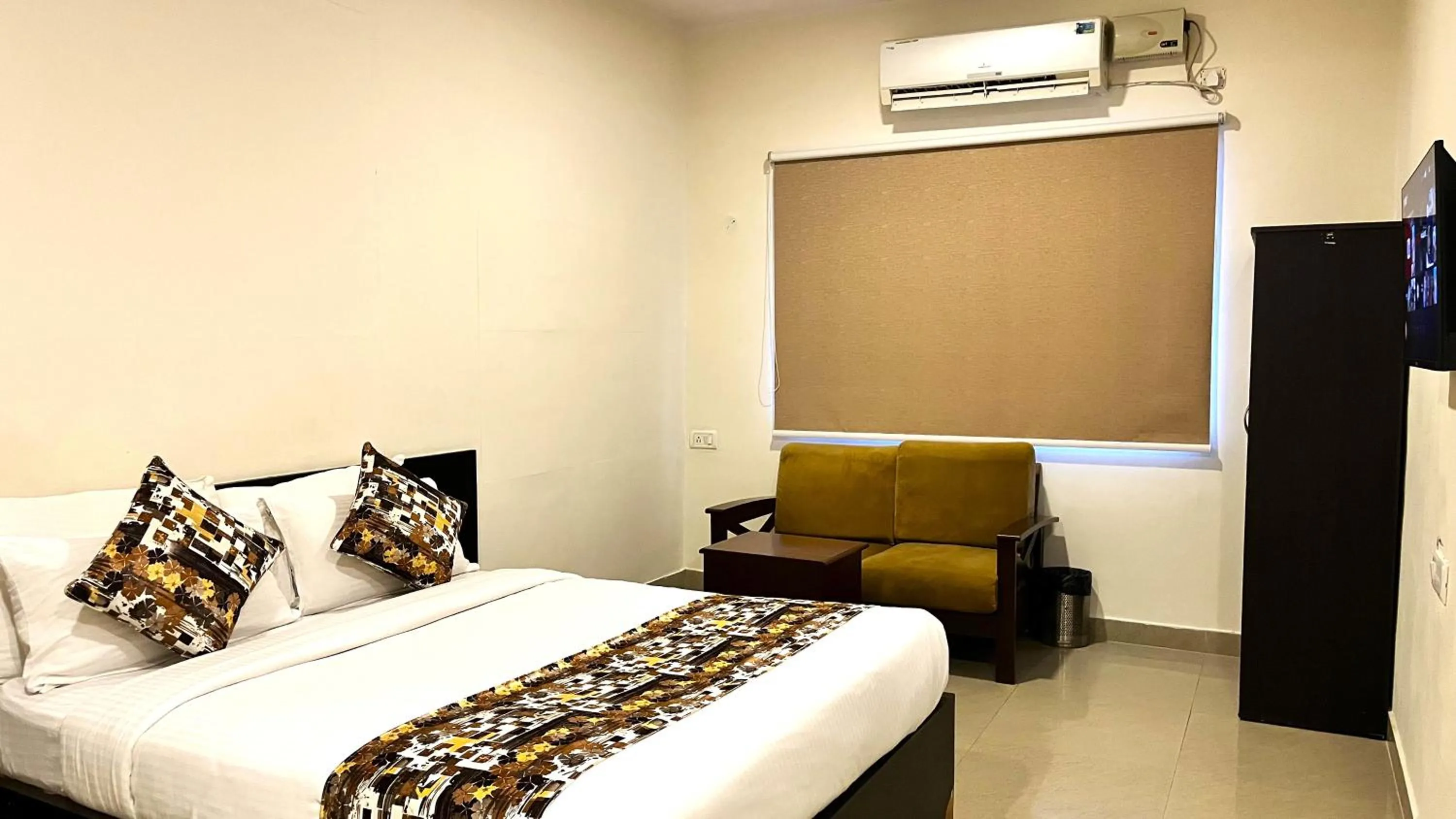 Communal lounge/ TV room in Athasri Hotel HSR Layout