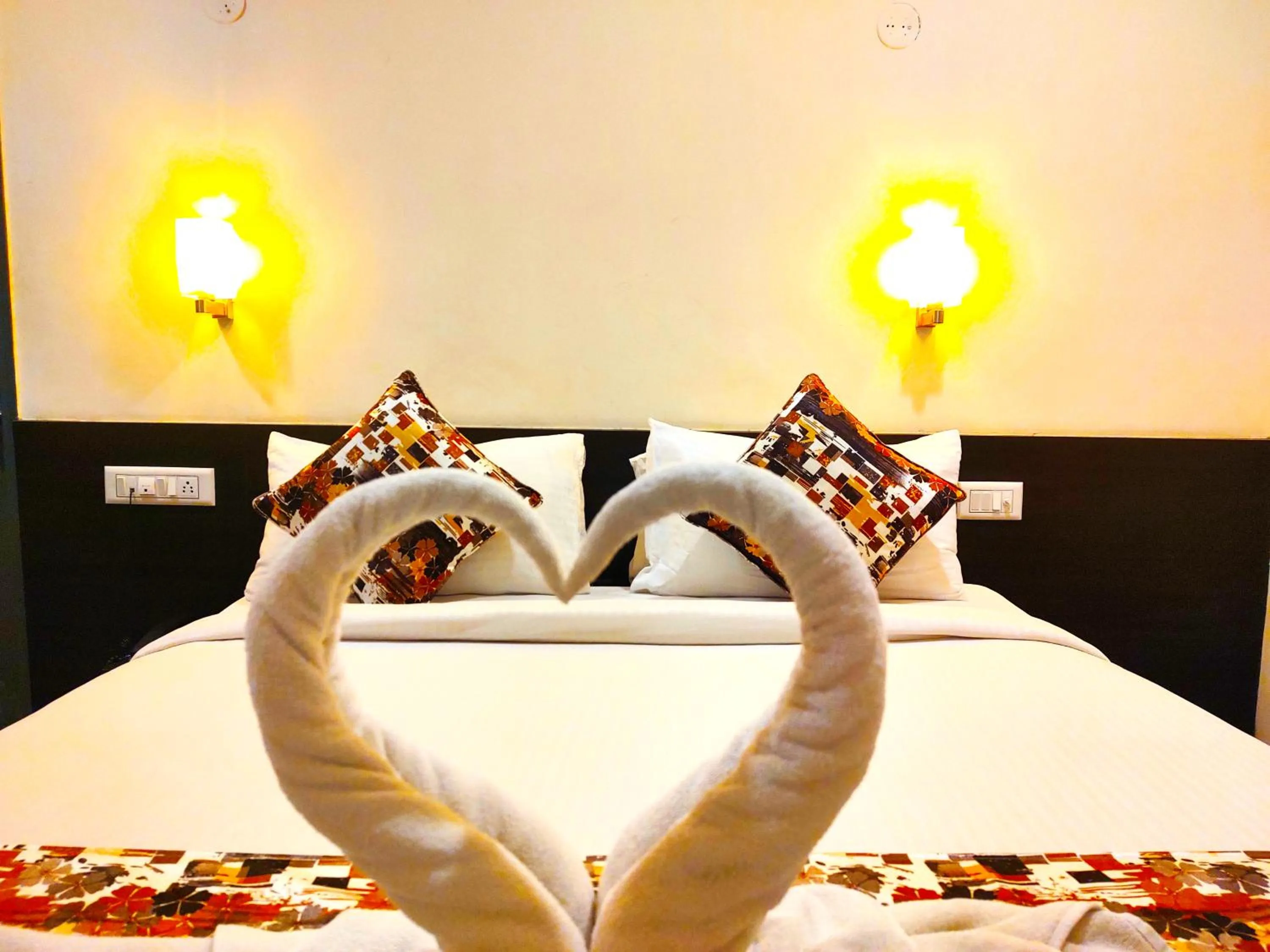 Bed in Athasri Hotel HSR Layout