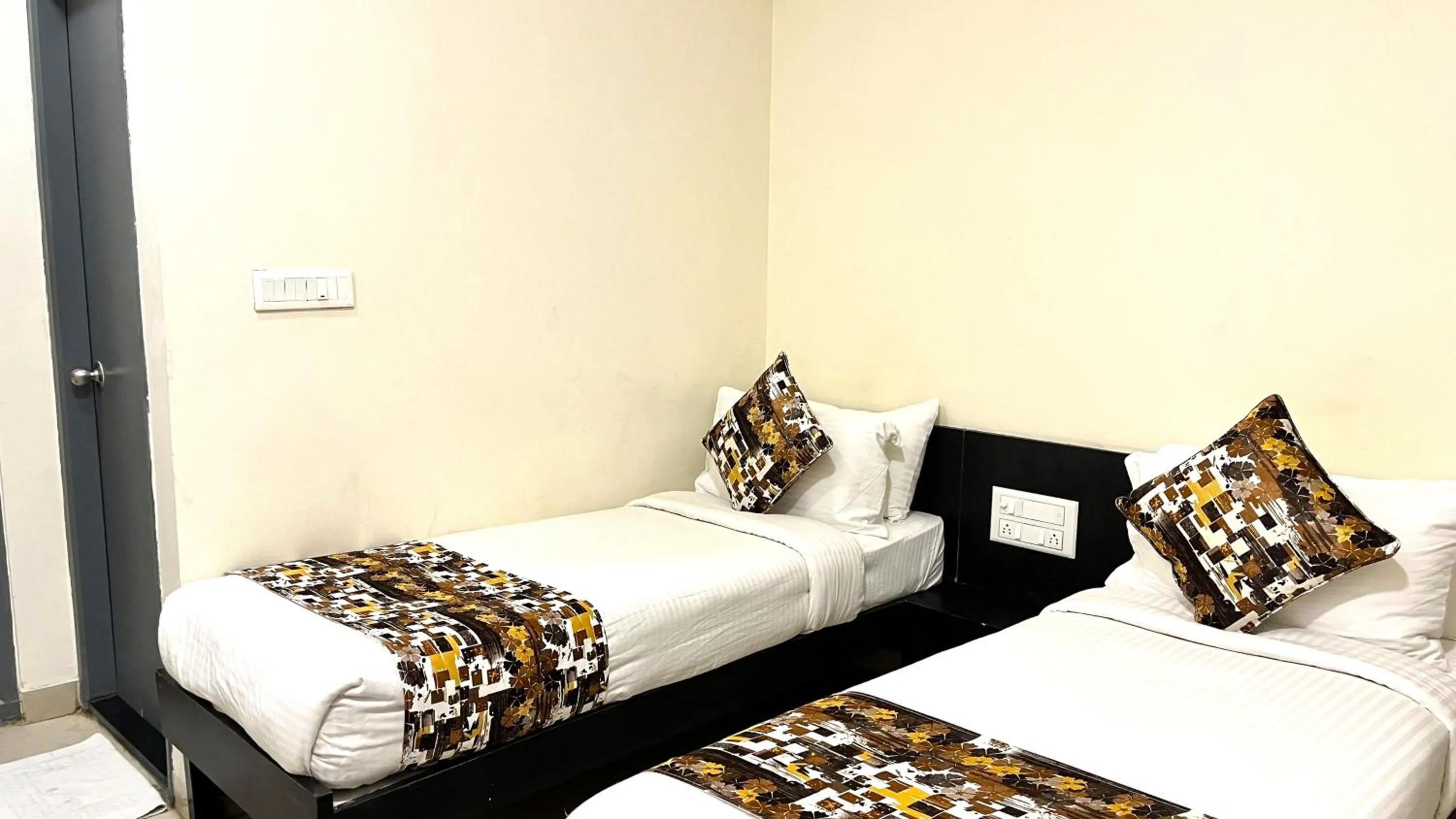 Bed in Athasri Hotel HSR Layout