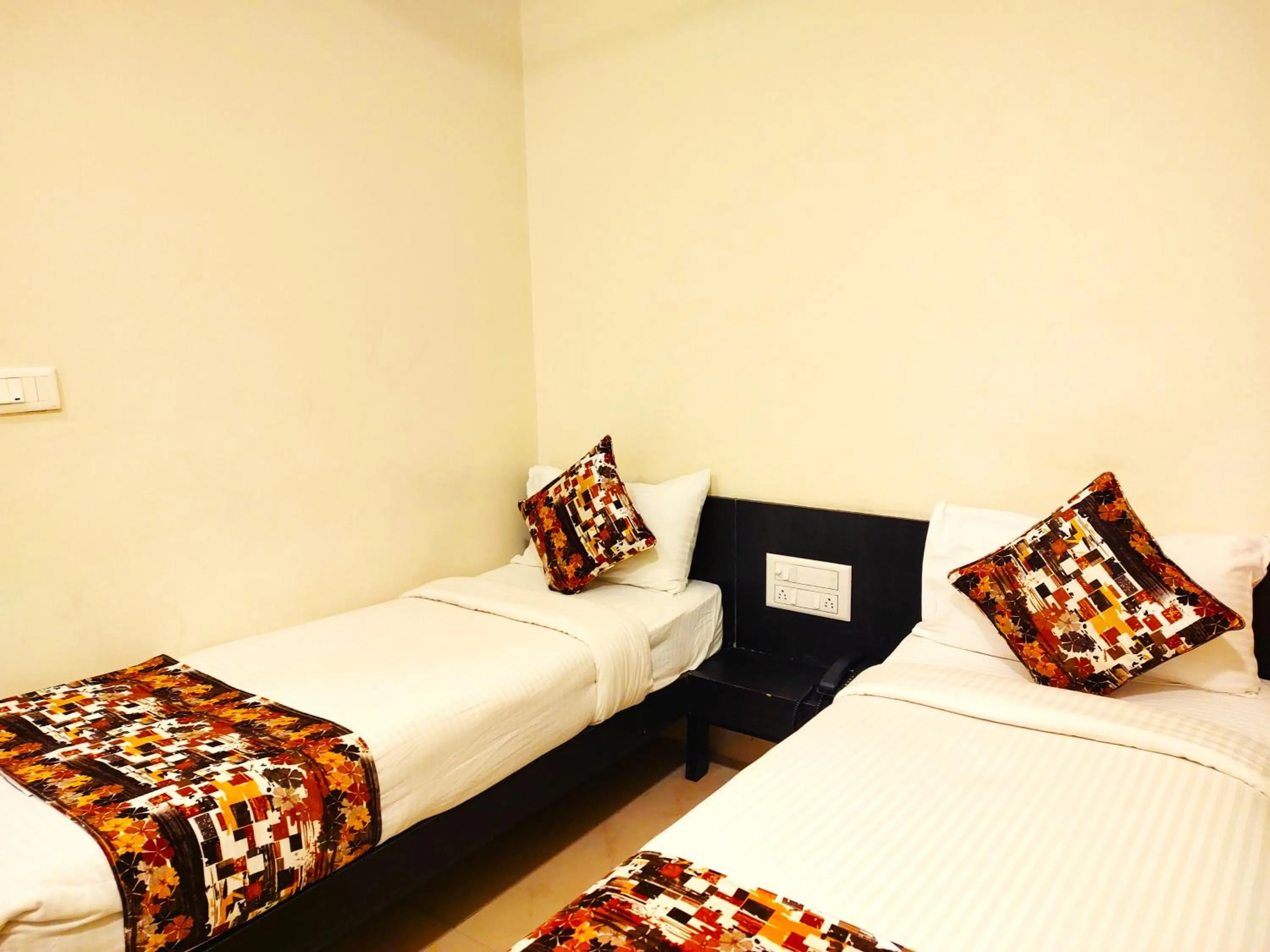Bed in Athasri Hotel HSR Layout