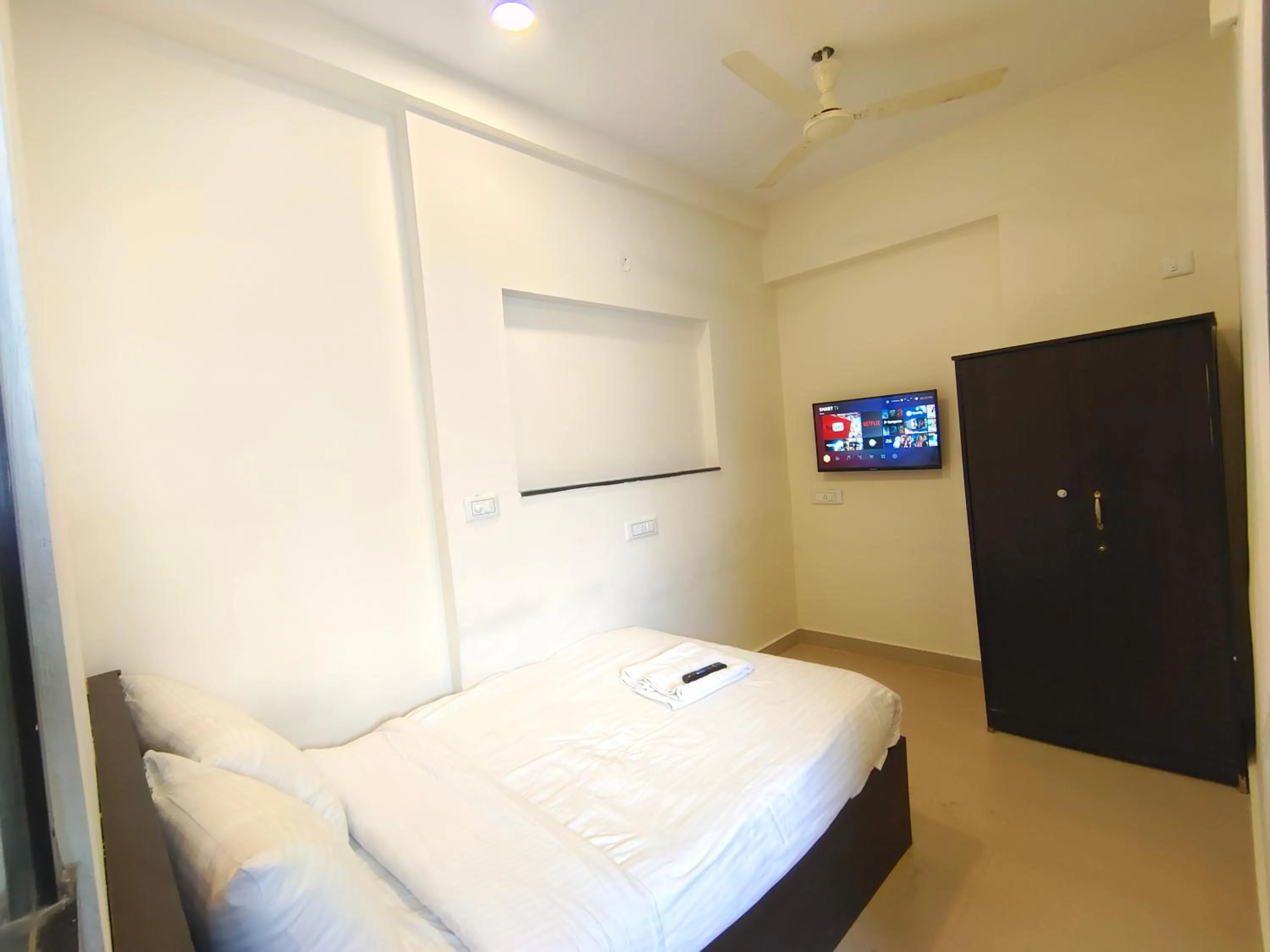 Bed in Athasri Hotel HSR Layout