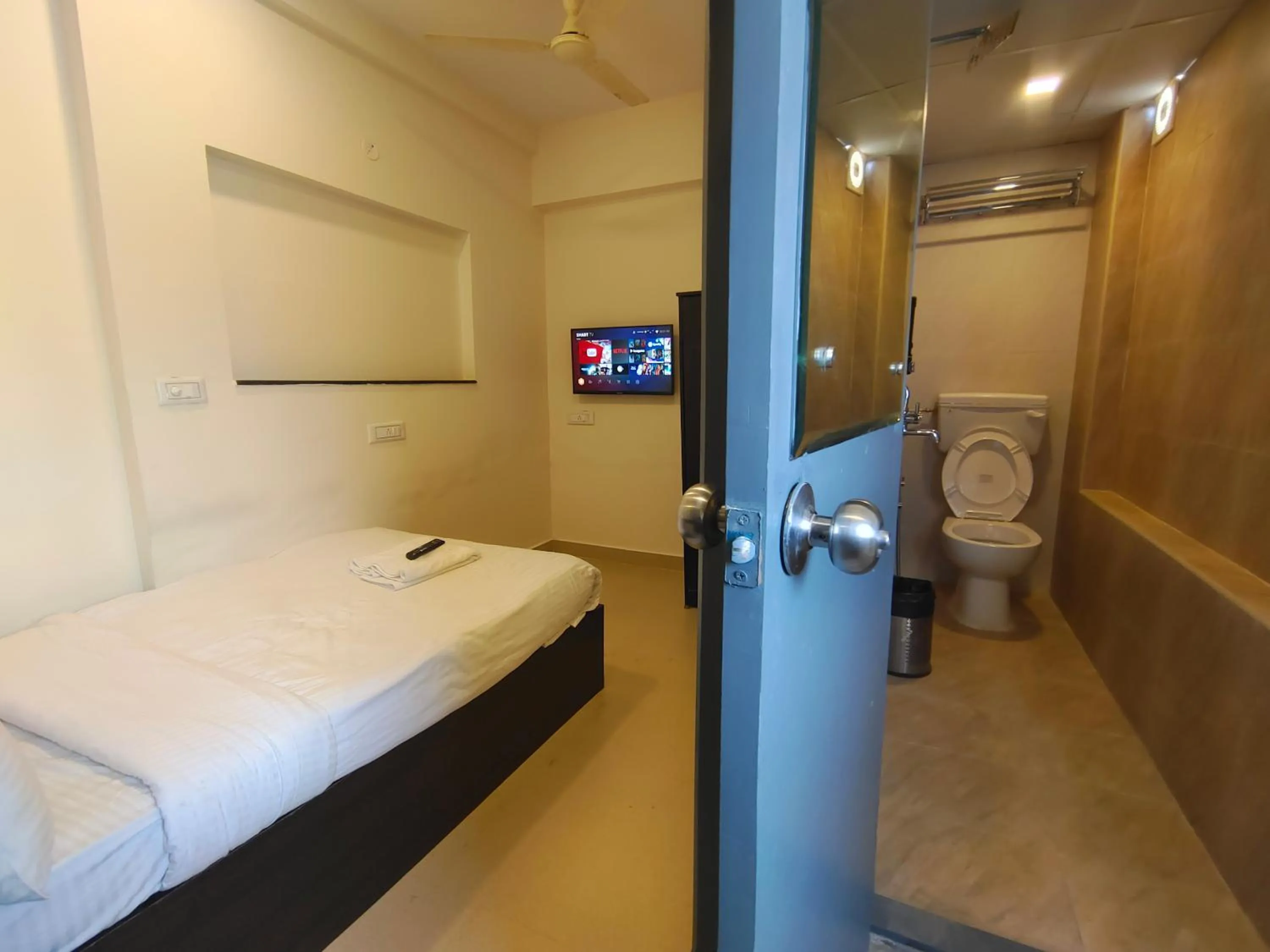 Bed in Athasri Hotel HSR Layout