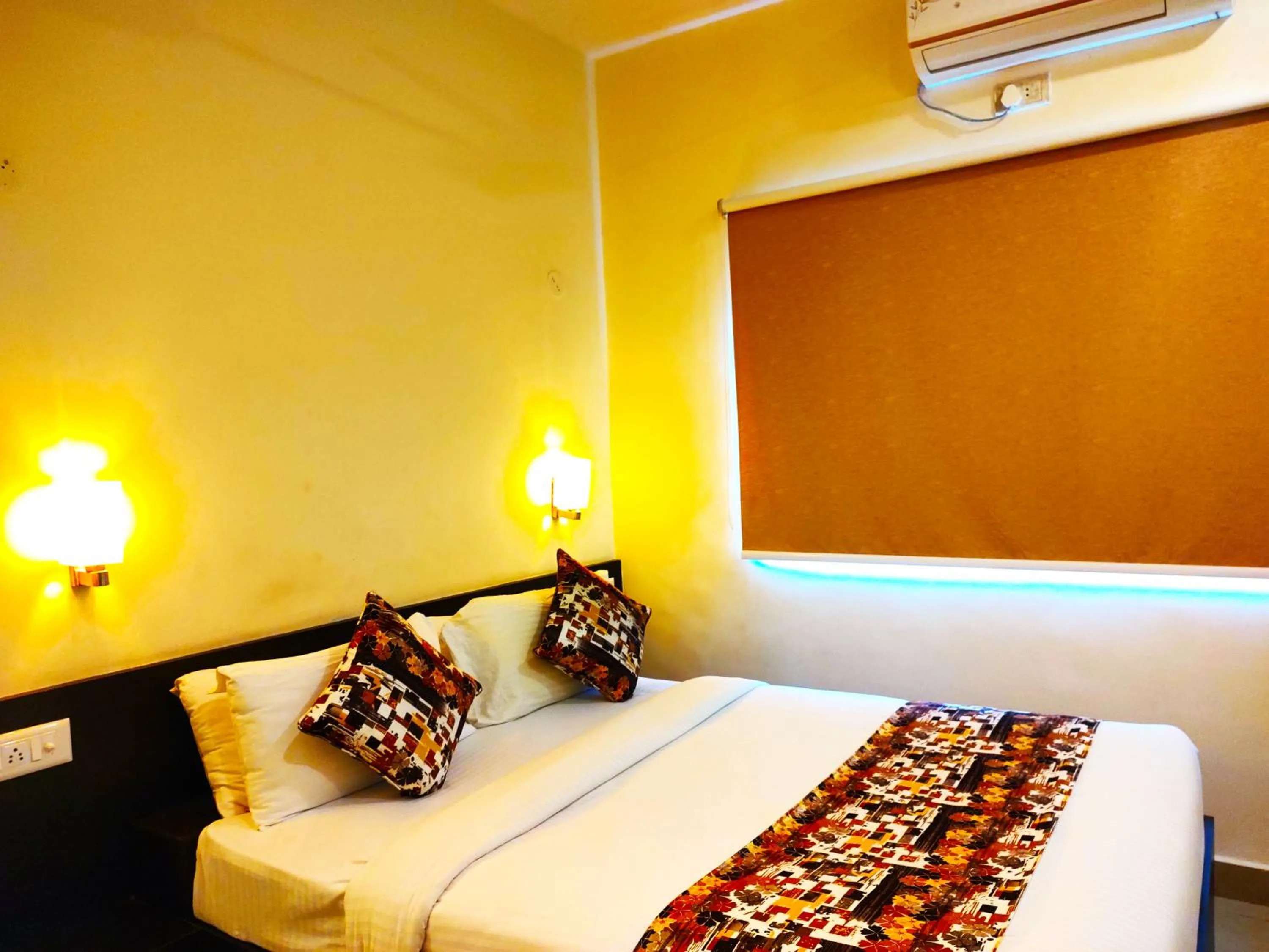 Bed in Athasri Hotel HSR Layout