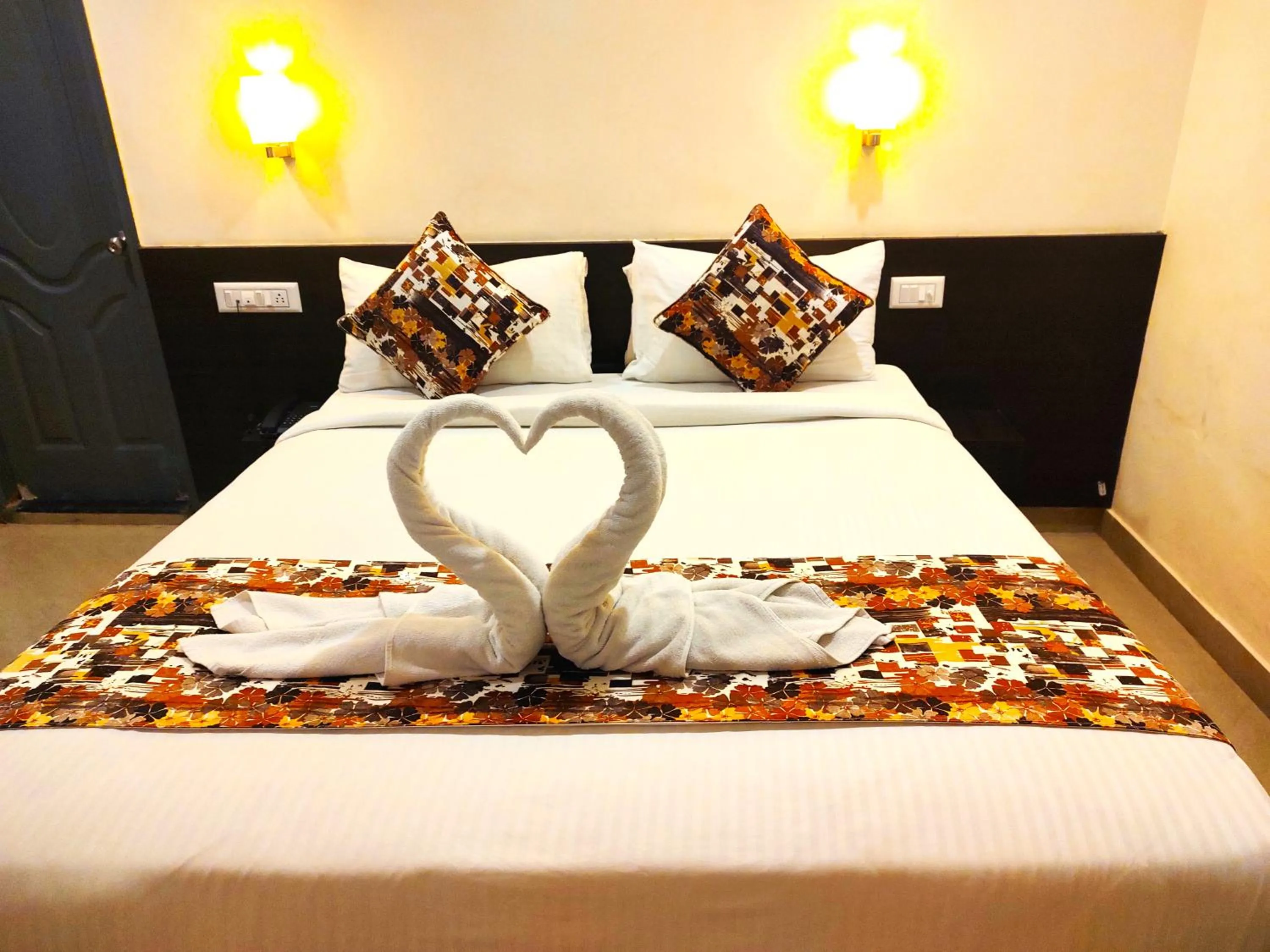 Bed in Athasri Hotel HSR Layout