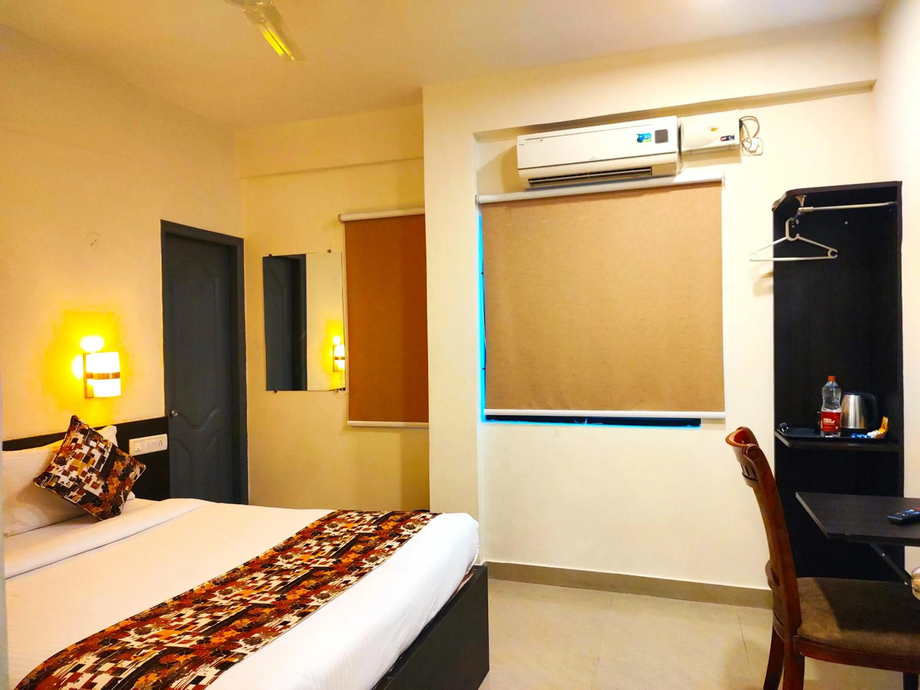 Bed in Athasri Hotel HSR Layout