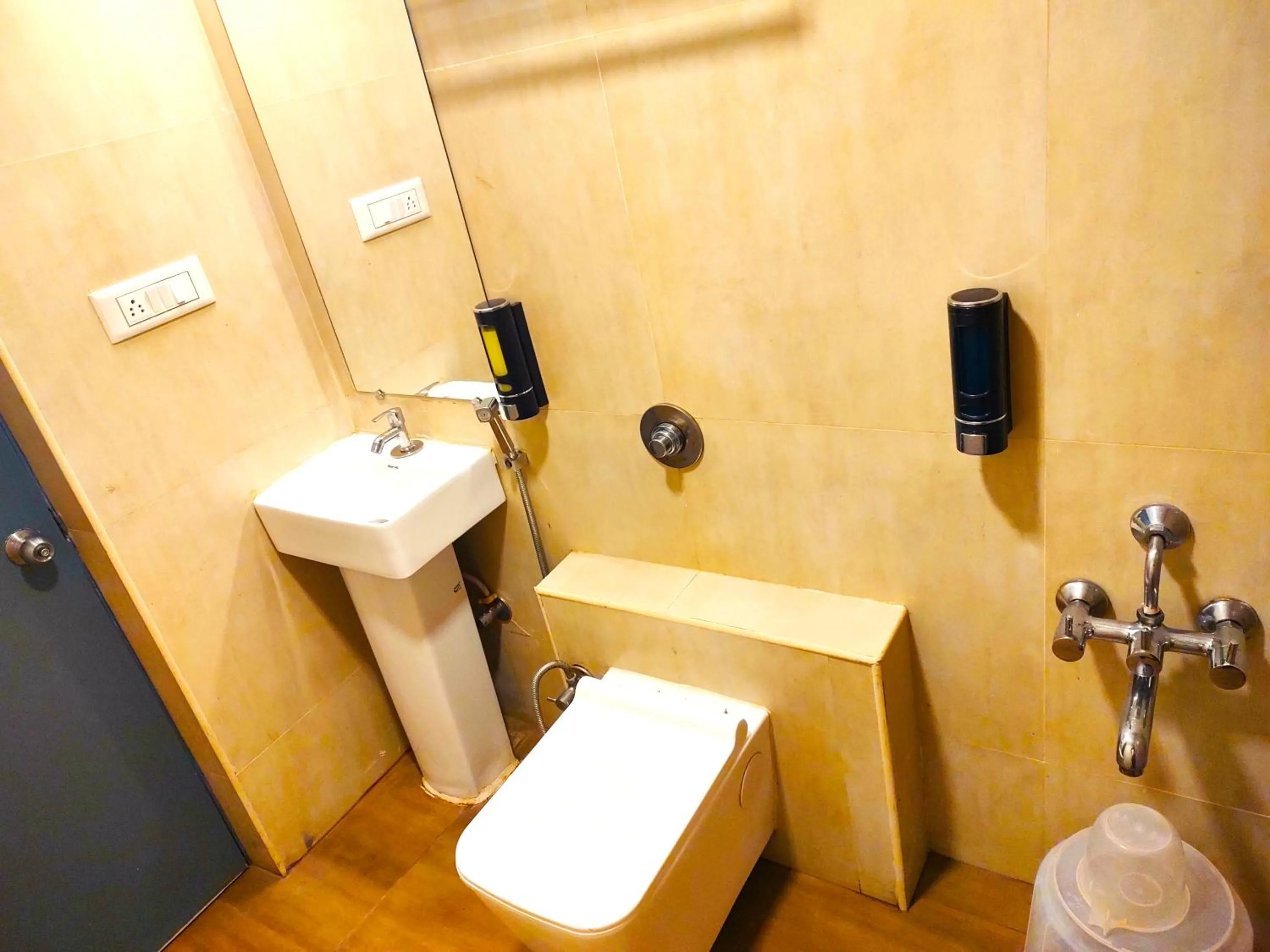 Toilet in Athasri Hotel HSR Layout