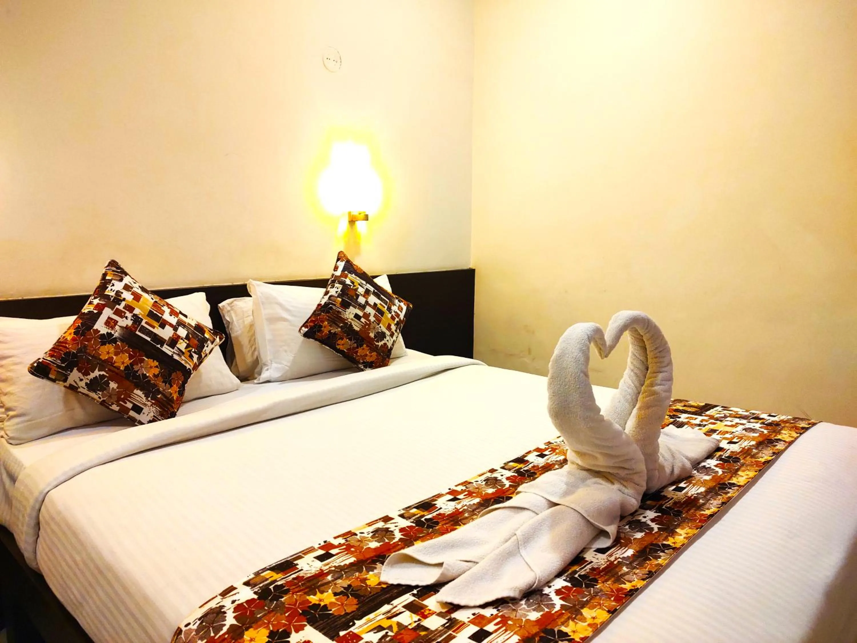 Bed in Athasri Hotel HSR Layout