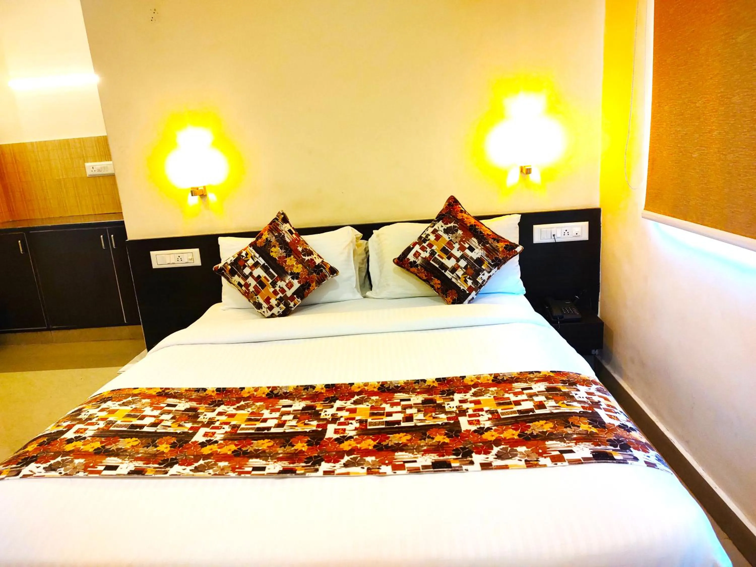 Bed in Athasri Hotel HSR Layout