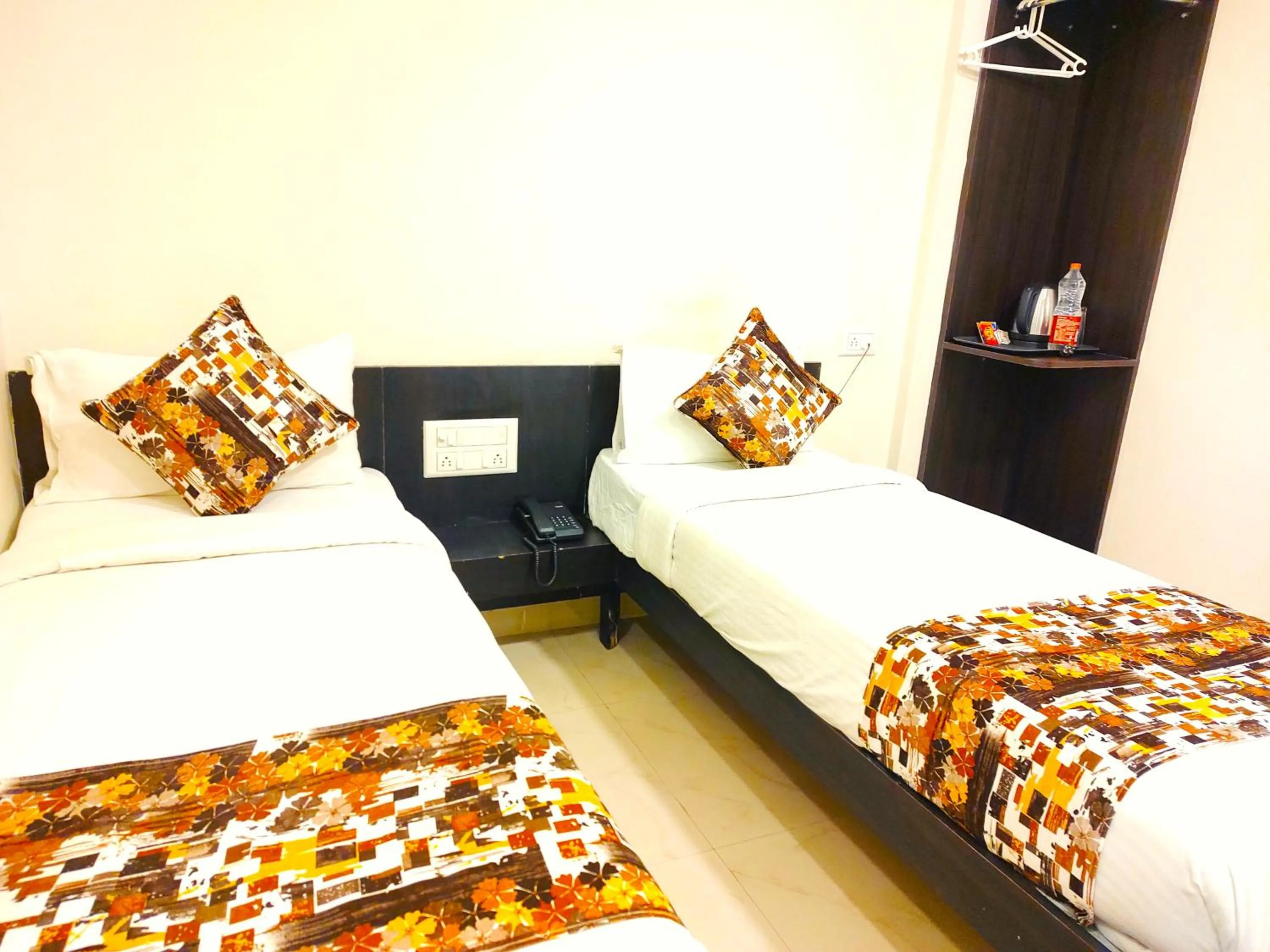 Bed in Athasri Hotel HSR Layout