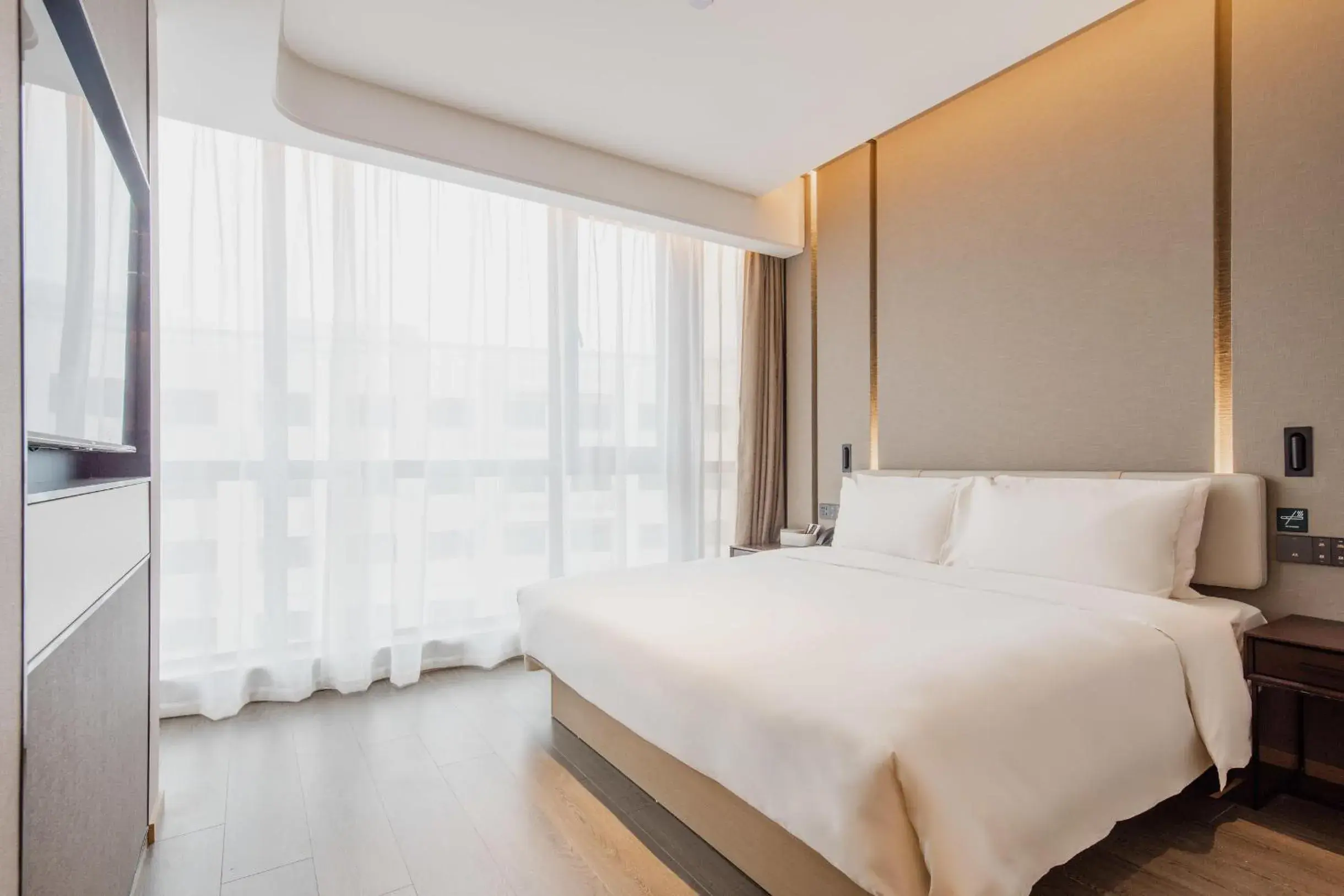 Bed in Atour Hotel Shanghai Pujiang Bed in Atour Hotel Shanghai Pujiang