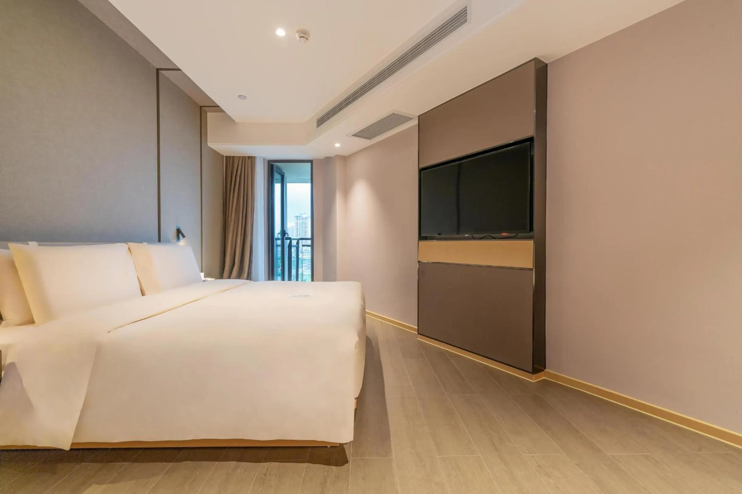 Bed in Atour Hotel Chongqing Yongchuan High-Speed Xinglong Lake