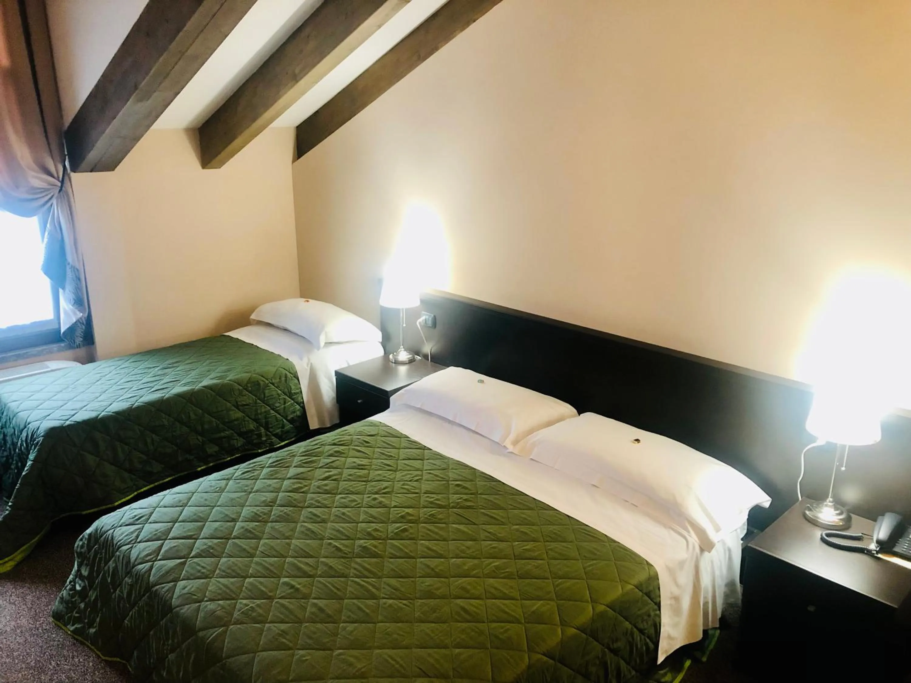 Photo of the whole room, Bed in Hotel Malpensa INN Aereoporto