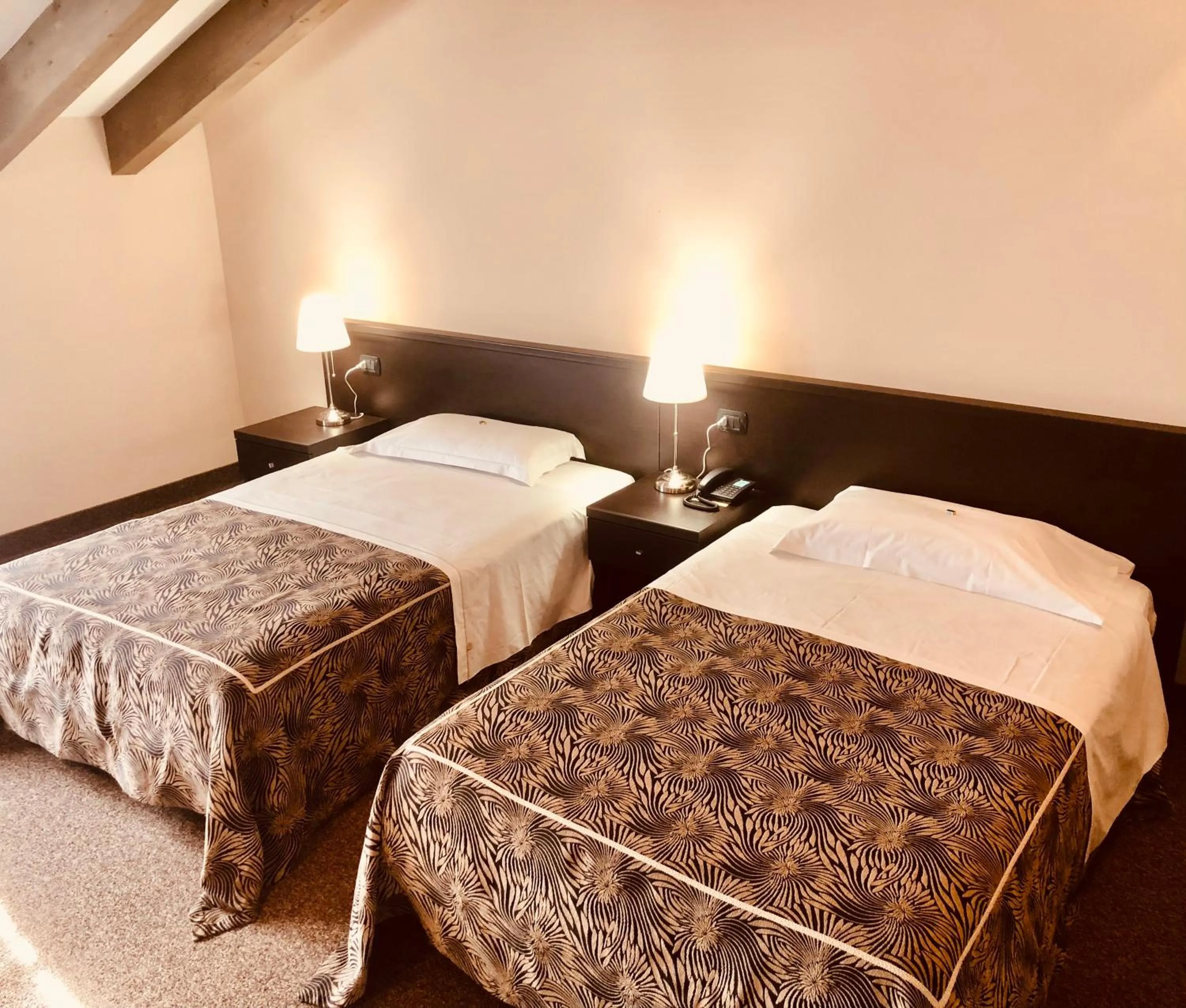 Photo of the whole room, Bed in Hotel Malpensa INN Aereoporto