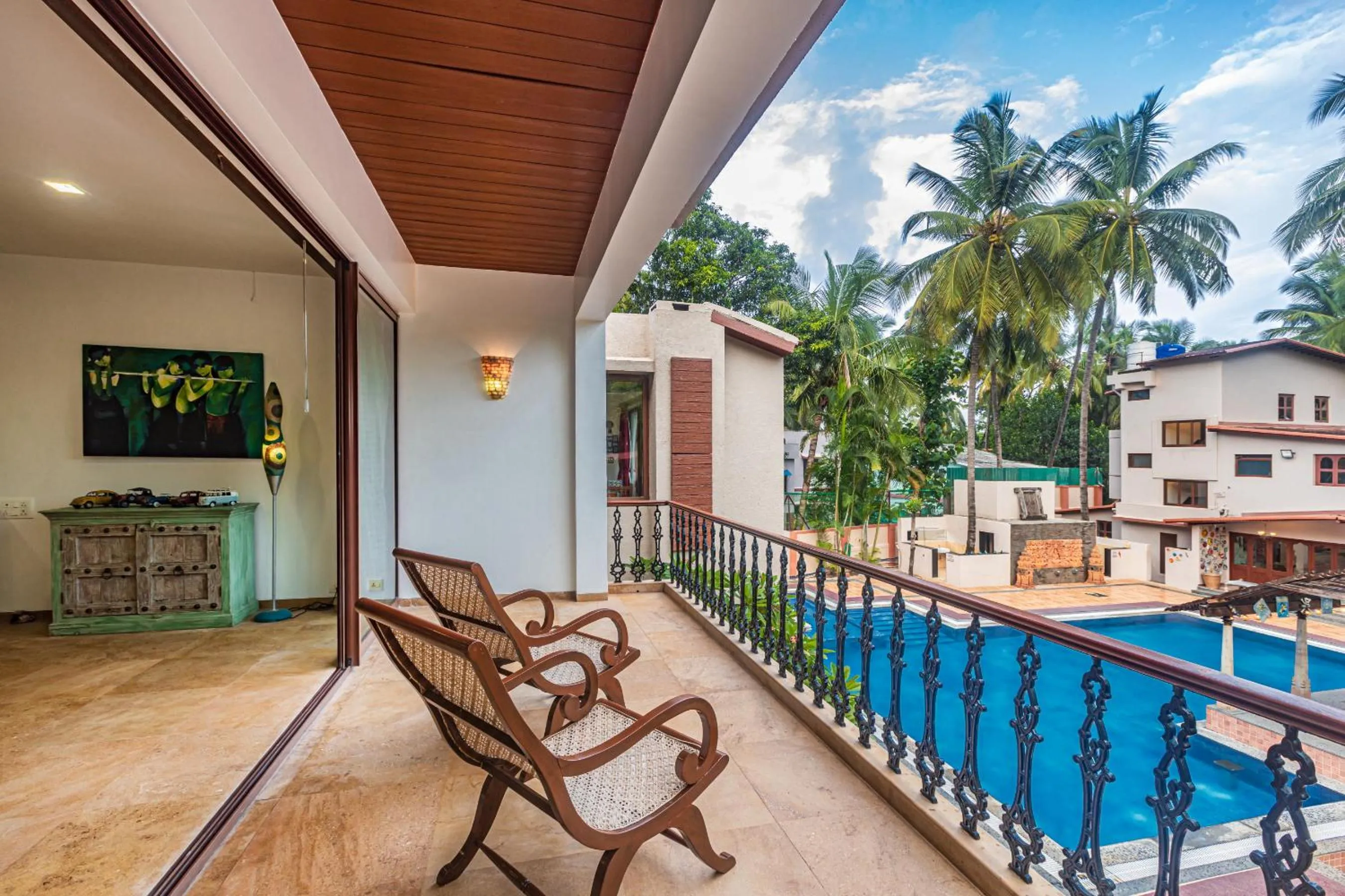 Property building in SaffronStays Casa Del Palms - 8BR luxury pool villa with gazebo, pickleball, bar & lawns near Nagaon Beach