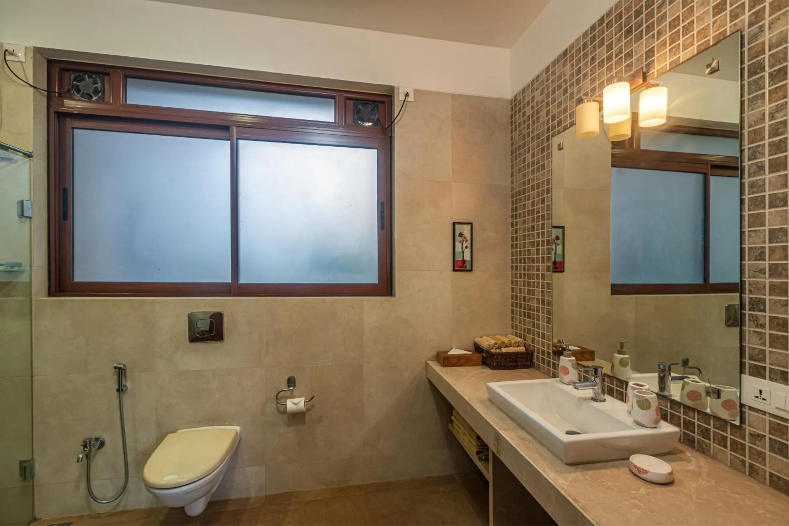 Toilet in SaffronStays Casa Del Palms - 8BR luxury pool villa with gazebo, pickleball, bar & lawns near Nagaon Beach