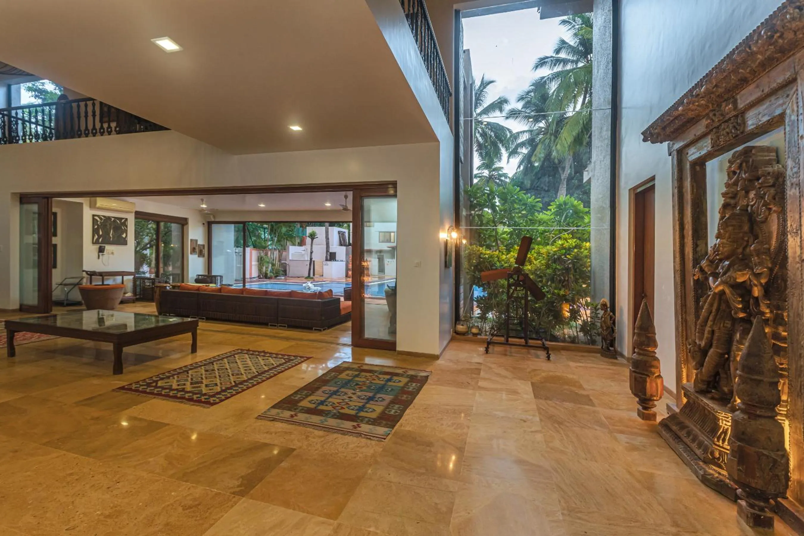 Living room in SaffronStays Casa Del Palms - 8BR luxury pool villa with gazebo, pickleball, bar & lawns near Nagaon Beach