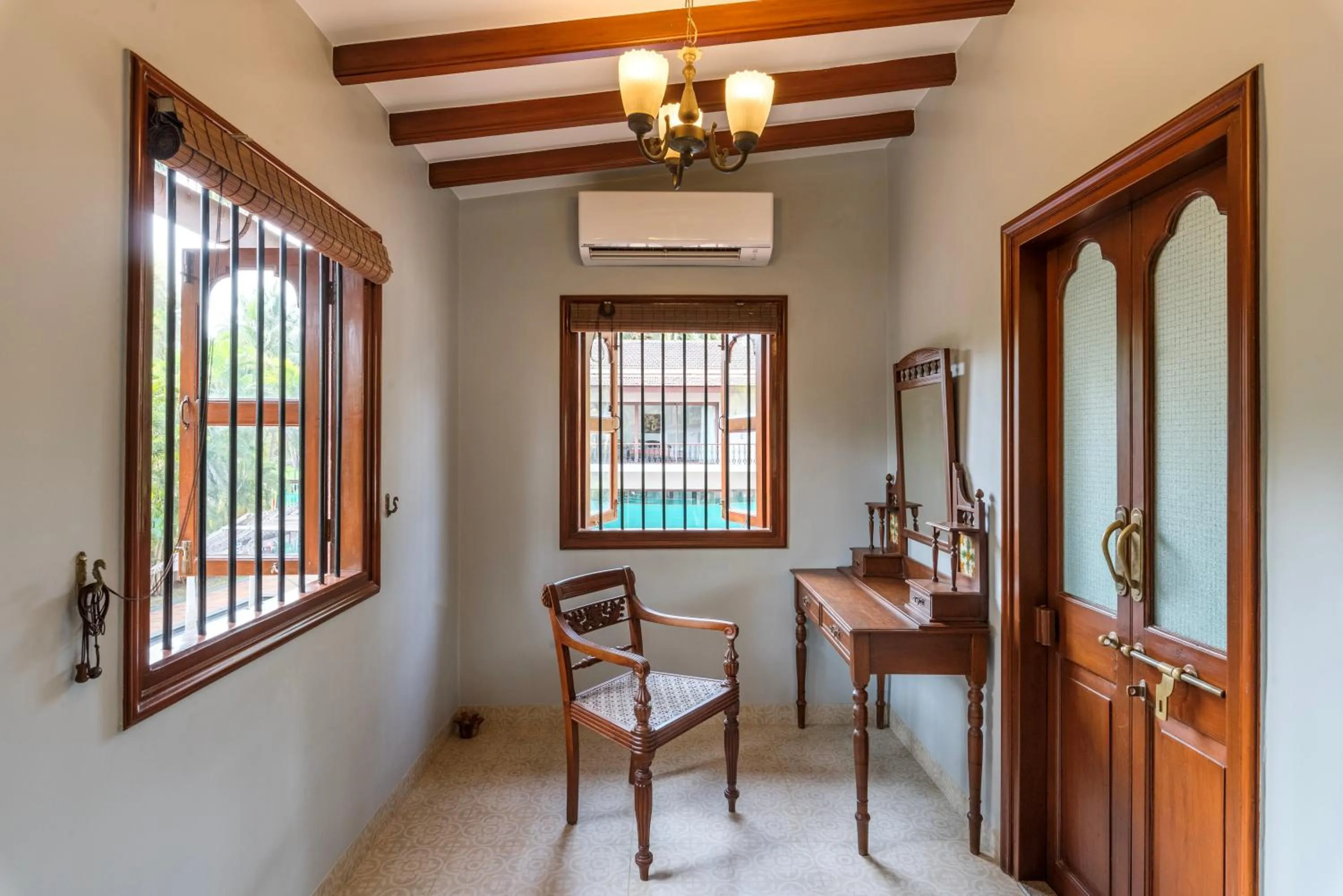 Seating area in SaffronStays Casa Del Palms - 8BR luxury pool villa with gazebo, pickleball, bar & lawns near Nagaon Beach