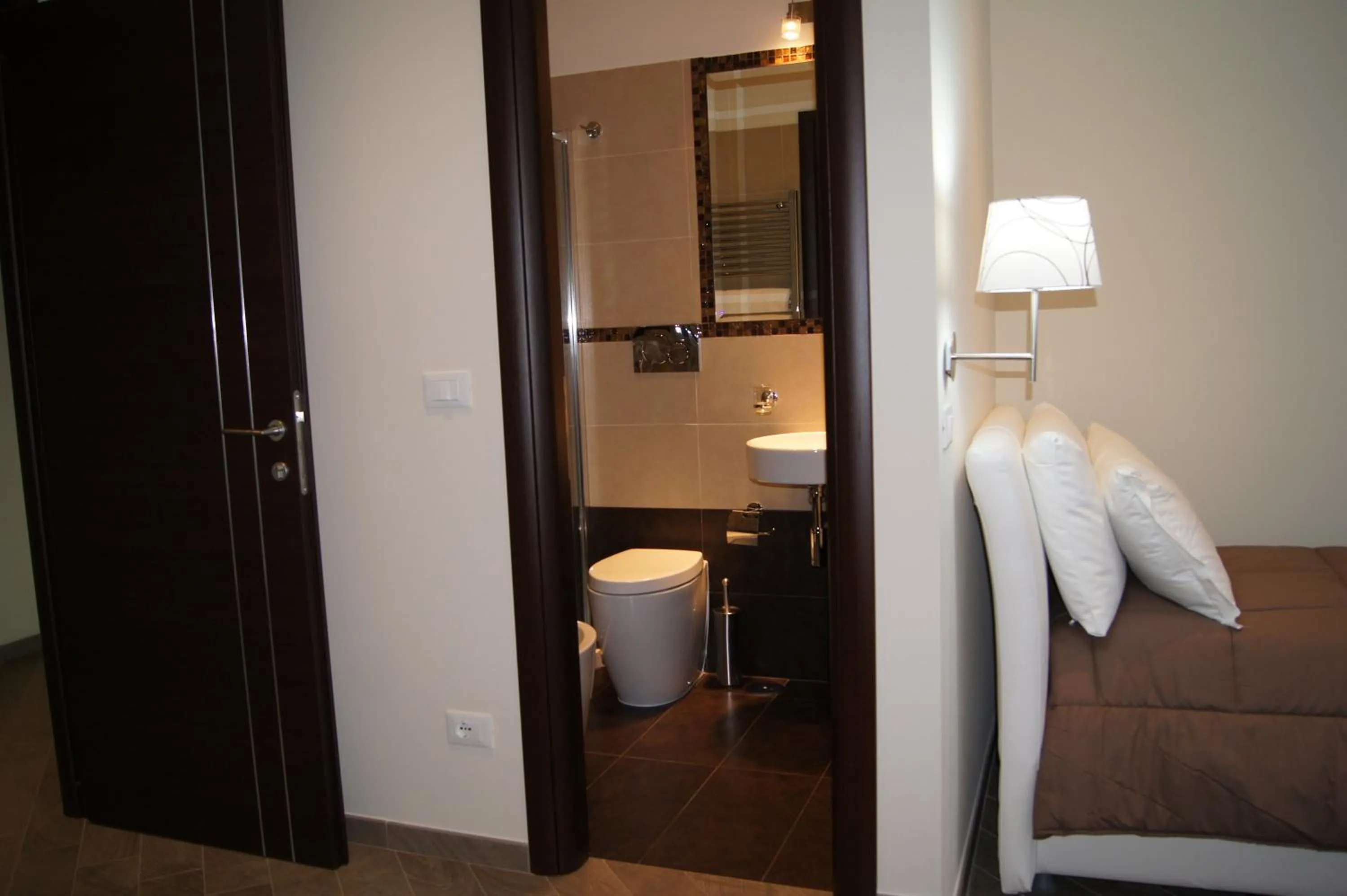 Toilet, Bed in Mia Suites