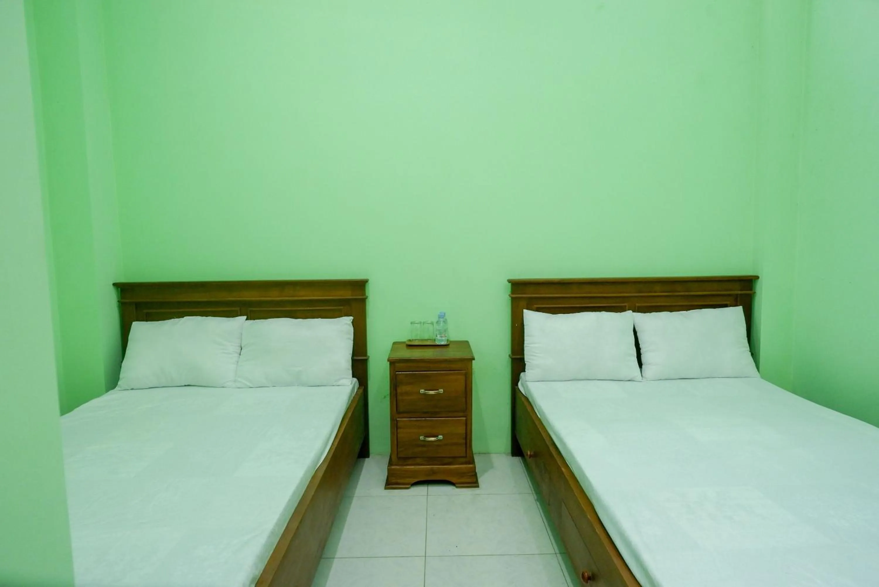 Bed in RedDoorz Syariah near Monumen Jogja Kembali