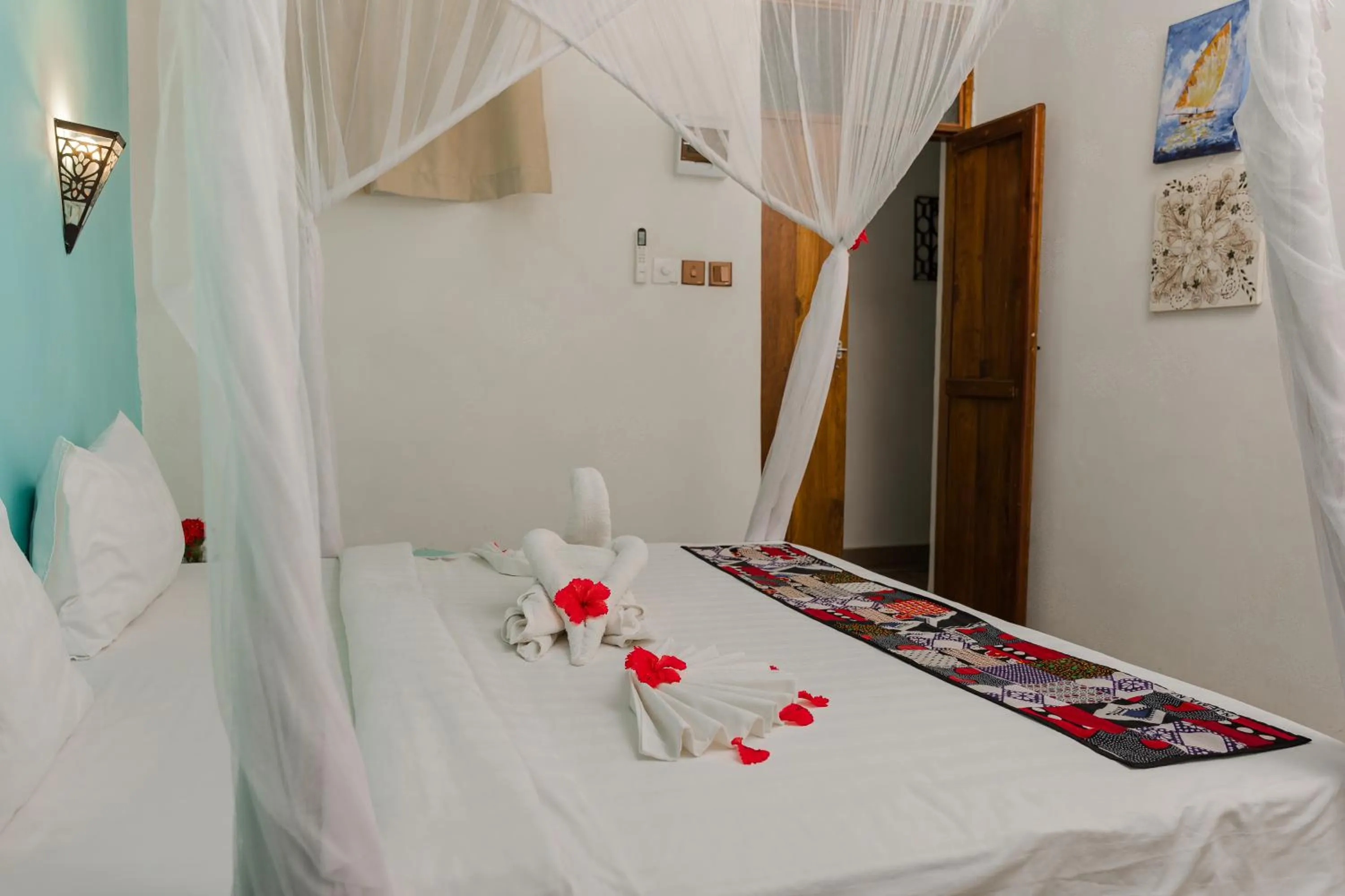 Bed in Emerald Palm Courtyard Hotel