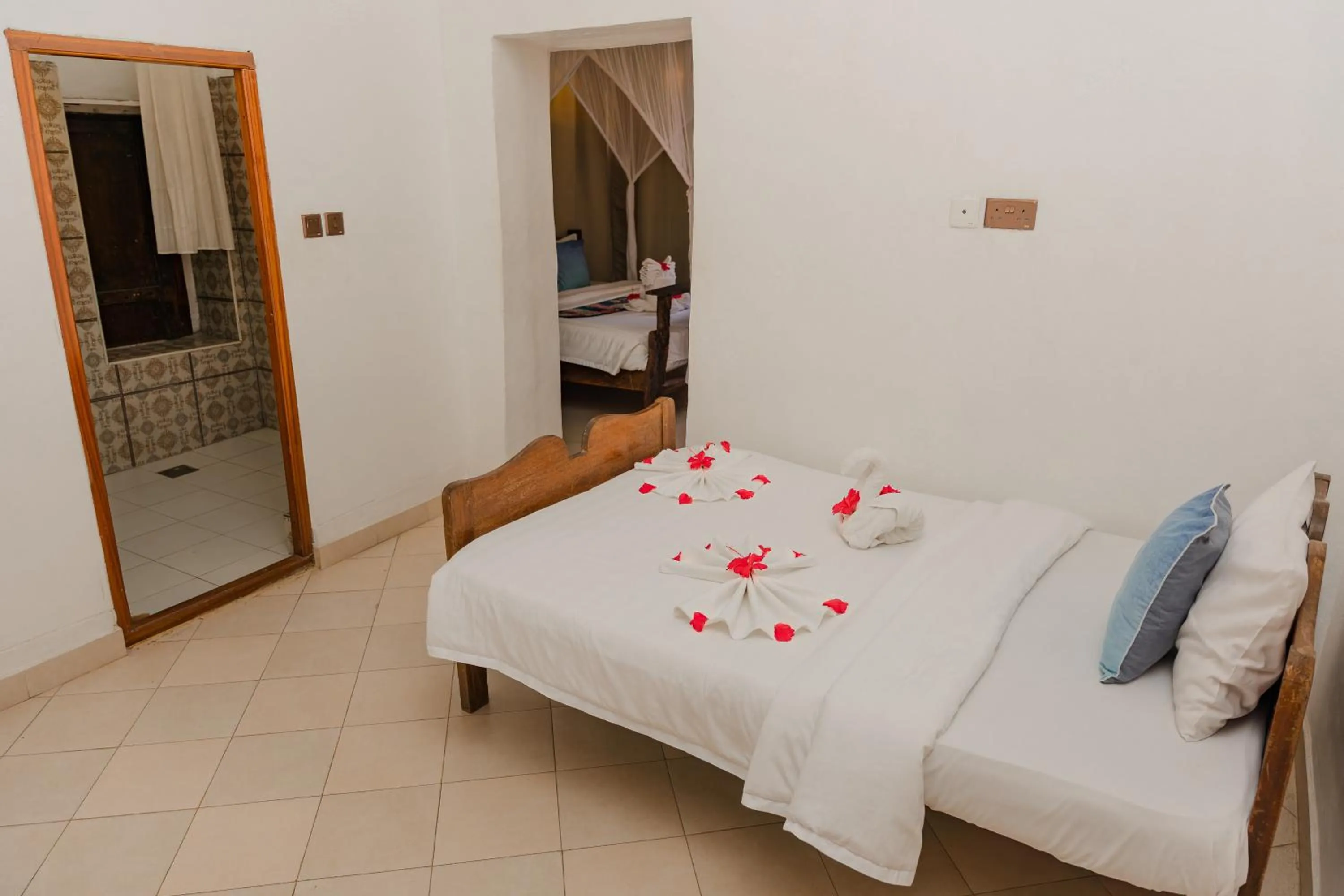 Bed in Emerald Palm Courtyard Hotel