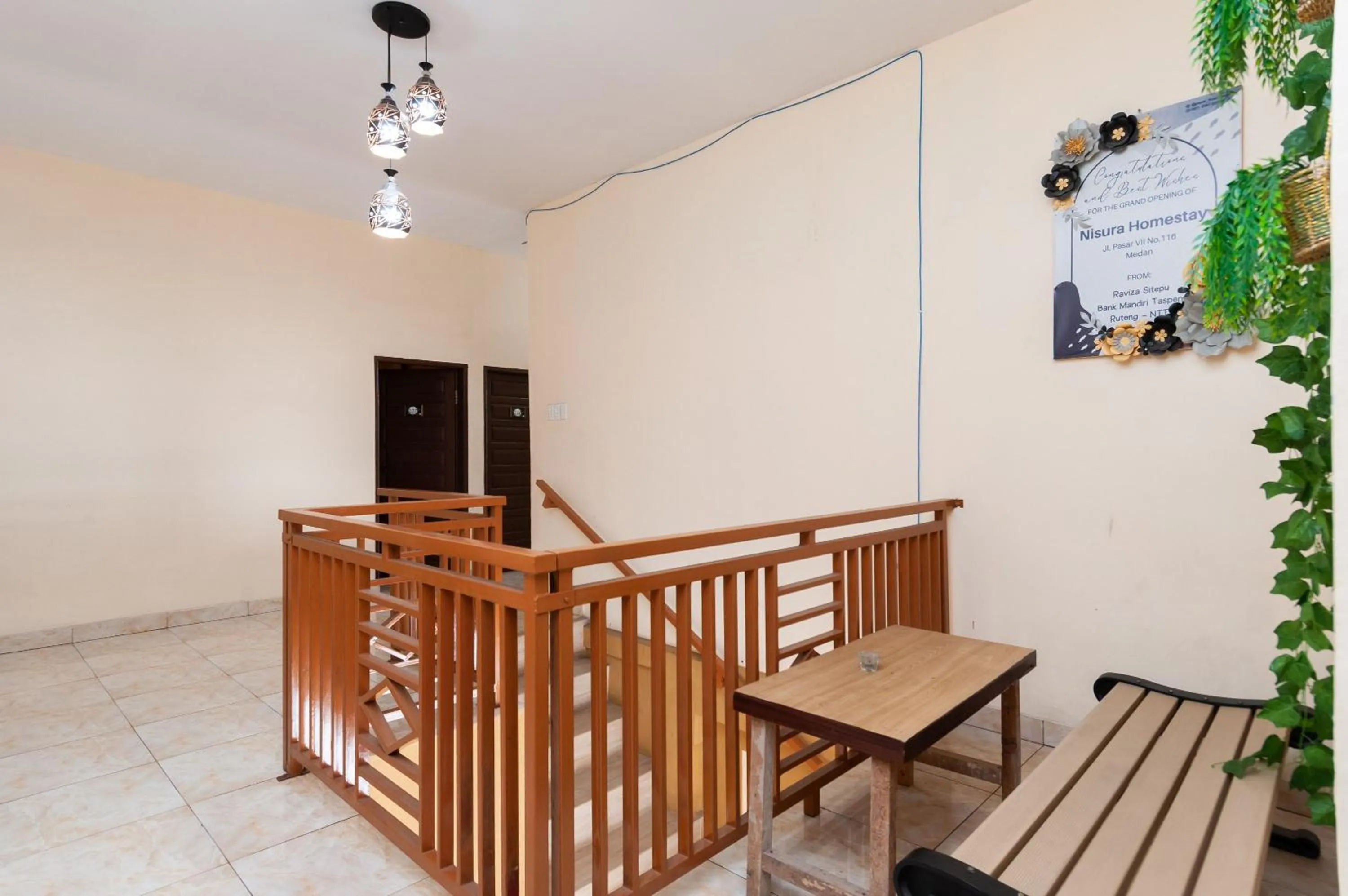 Seating area in Urbanview Hotel Nisura Homestay Medan by RedDoorz