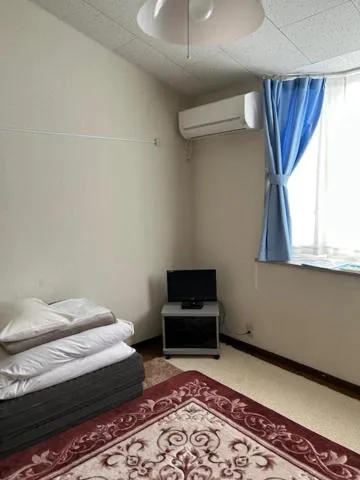 Photo of the whole room, Bed in Petit Hotel Koizumi