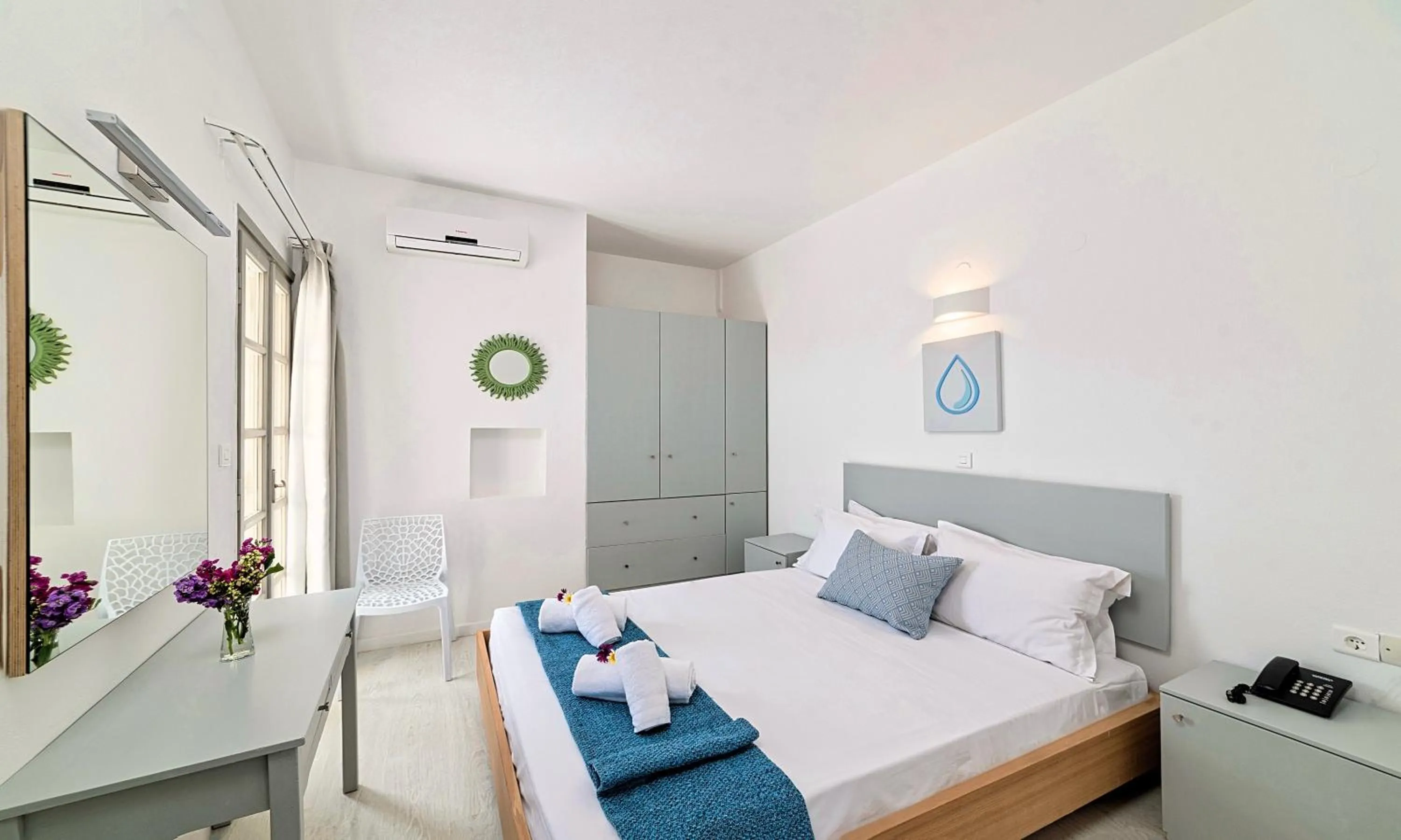 Bedroom, Bed in Elounda Garden Suites Heated Pool