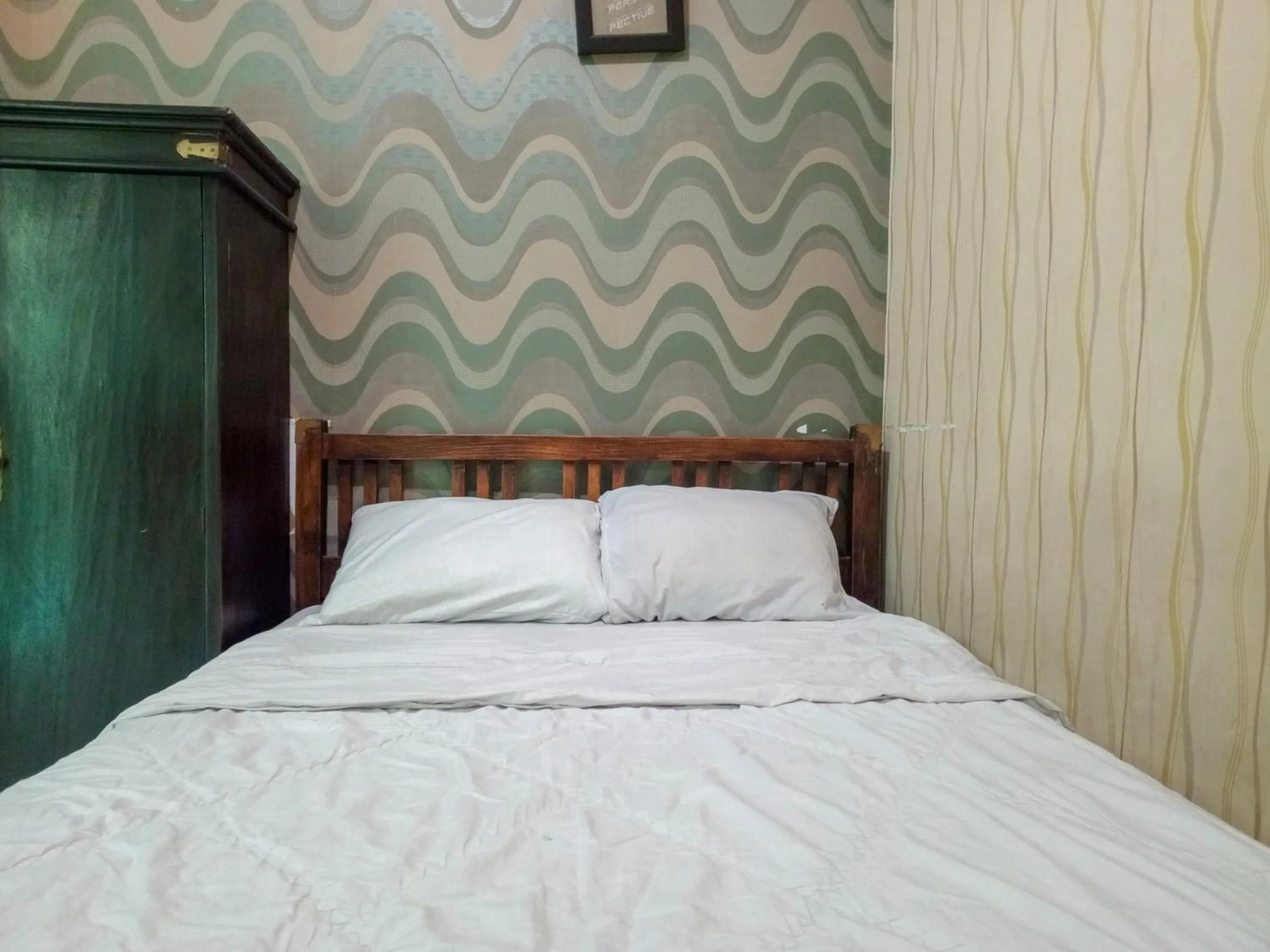 Bedroom, Bed in Trihakso Guest House near Kaliurang RedPartner