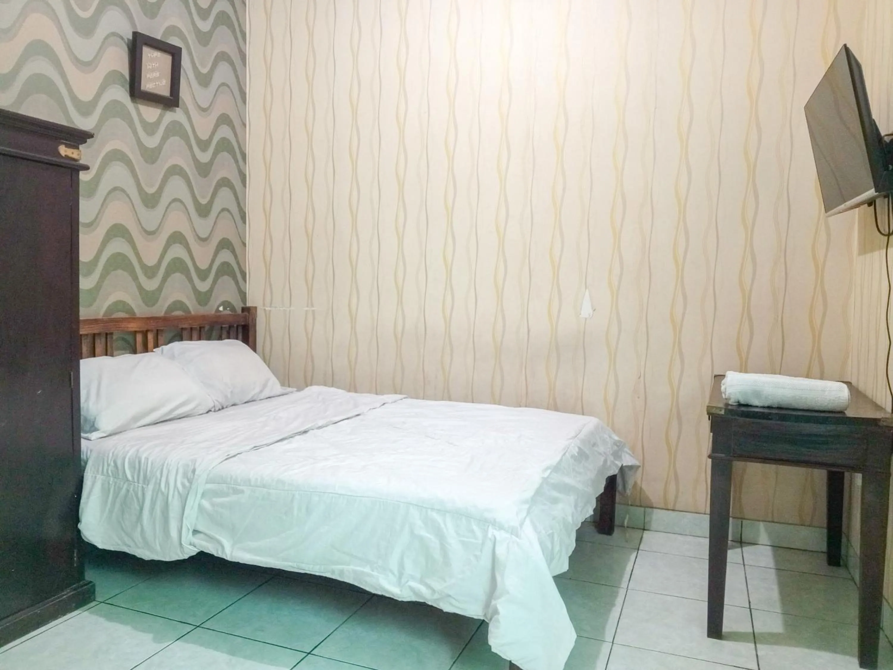 Bedroom, Bed in Trihakso Guest House near Kaliurang RedPartner
