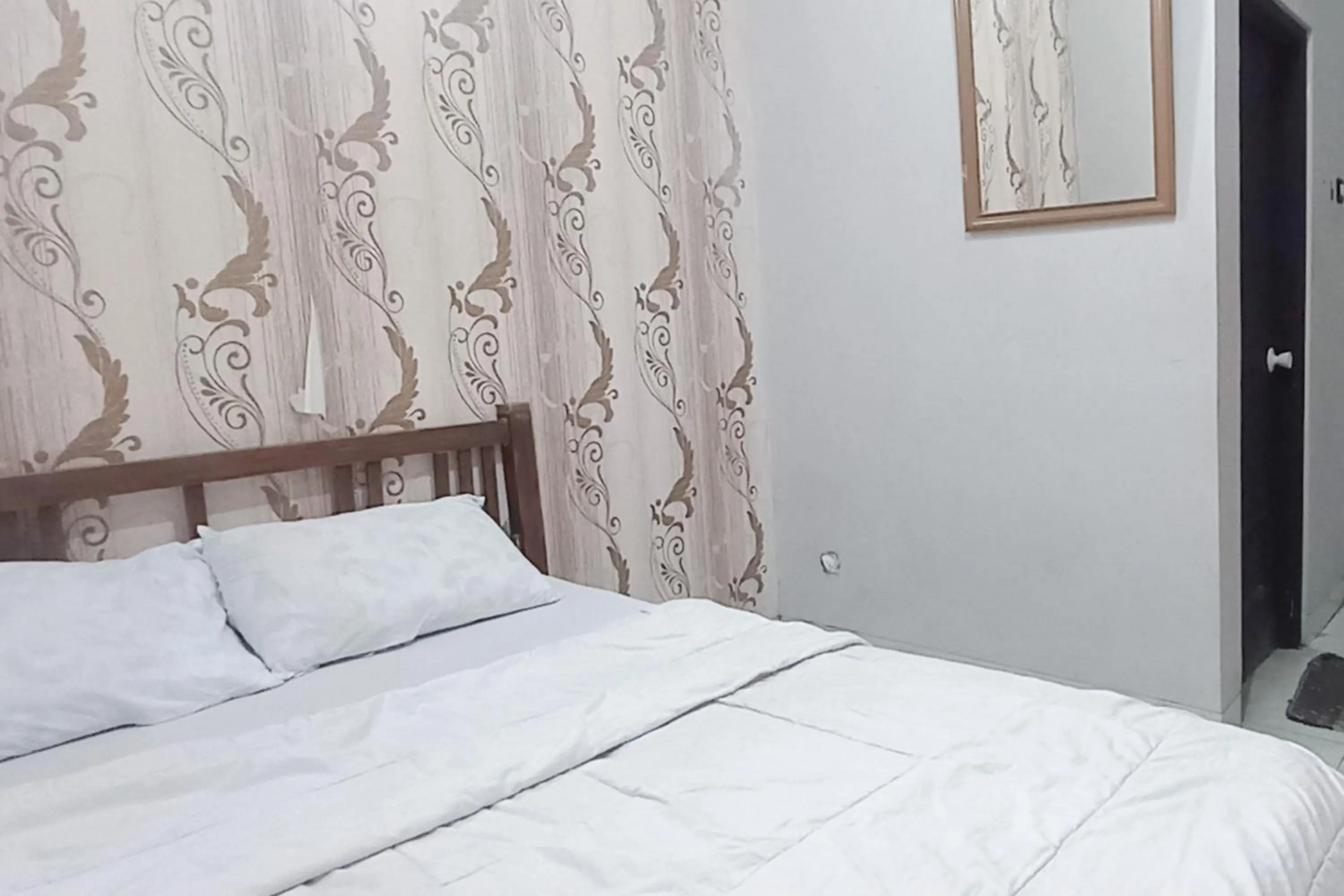 Bedroom, Bed in Trihakso Guest House near Kaliurang RedPartner